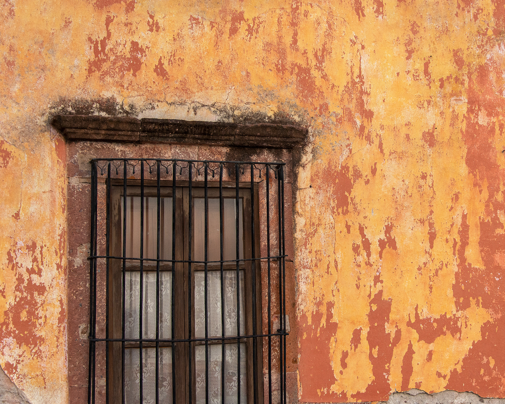 Window on Yellow Wall