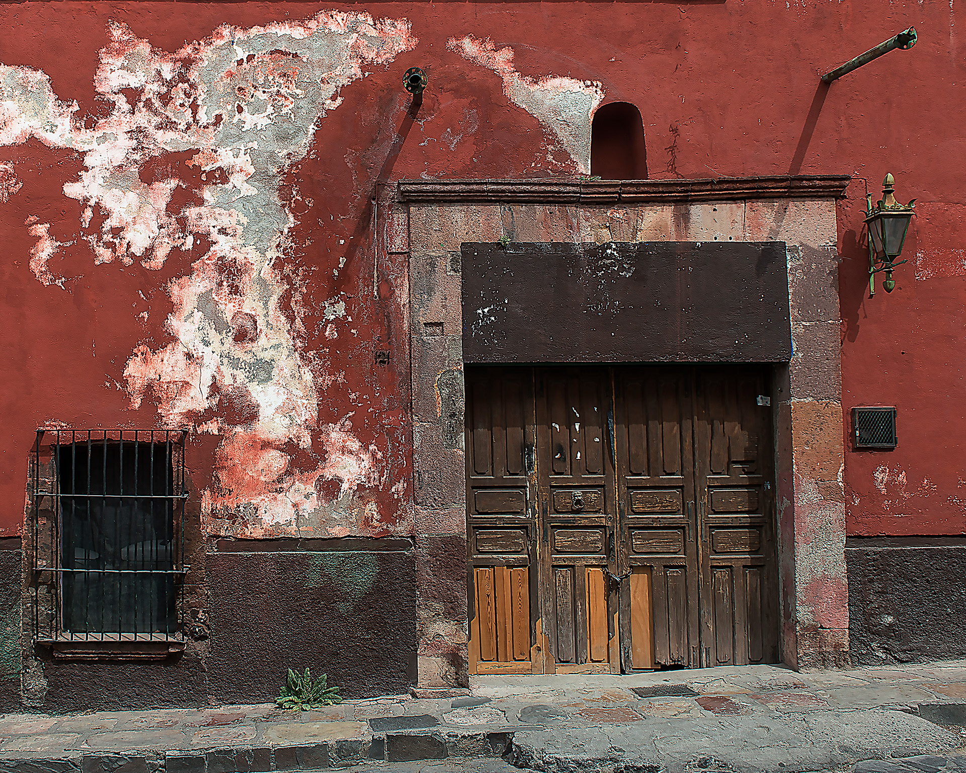 Red Wall and Brown Door