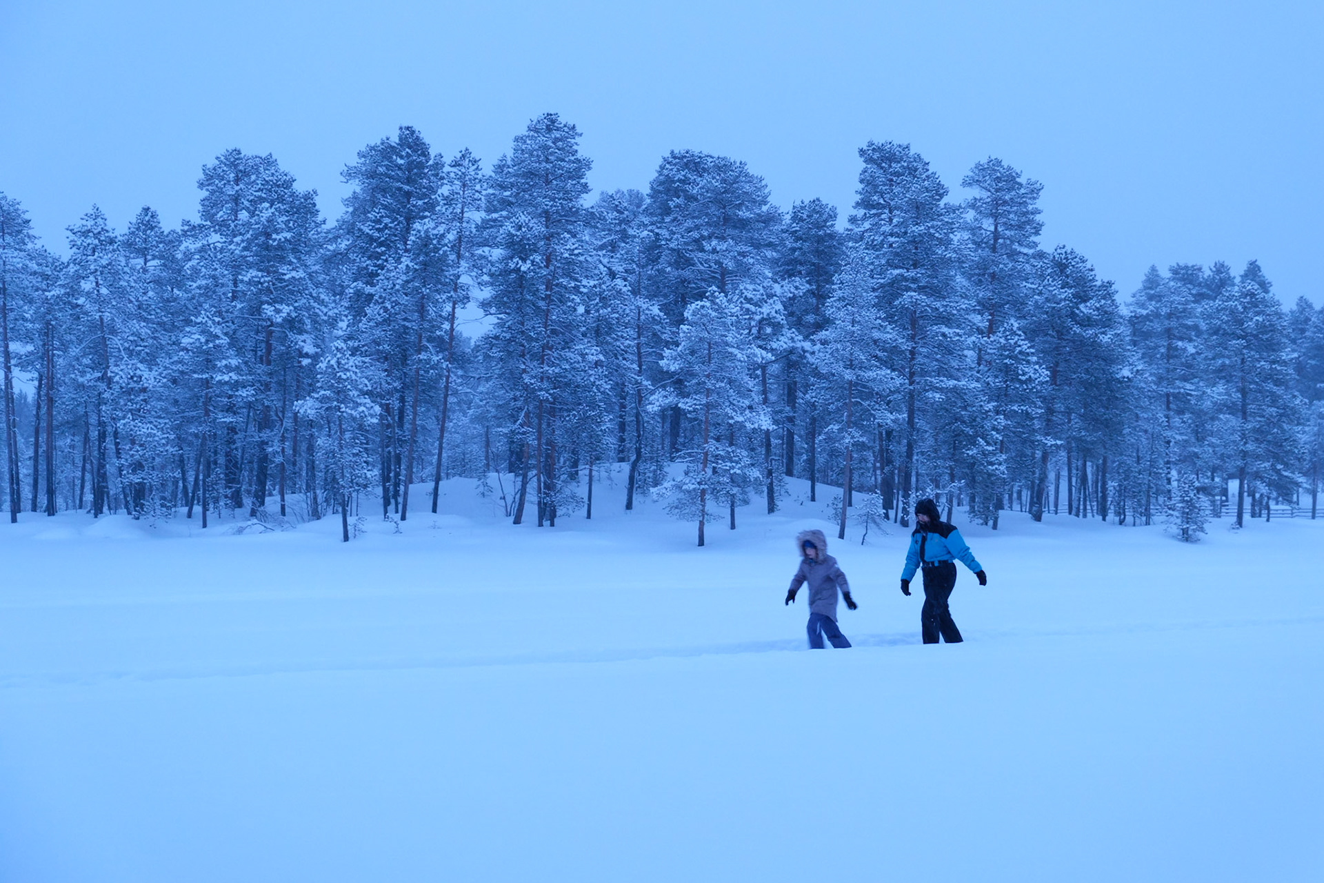 Exploring Lake Maa below Nellim Wilderness Hotel at dusk, Nellim, Finnish Lapland.