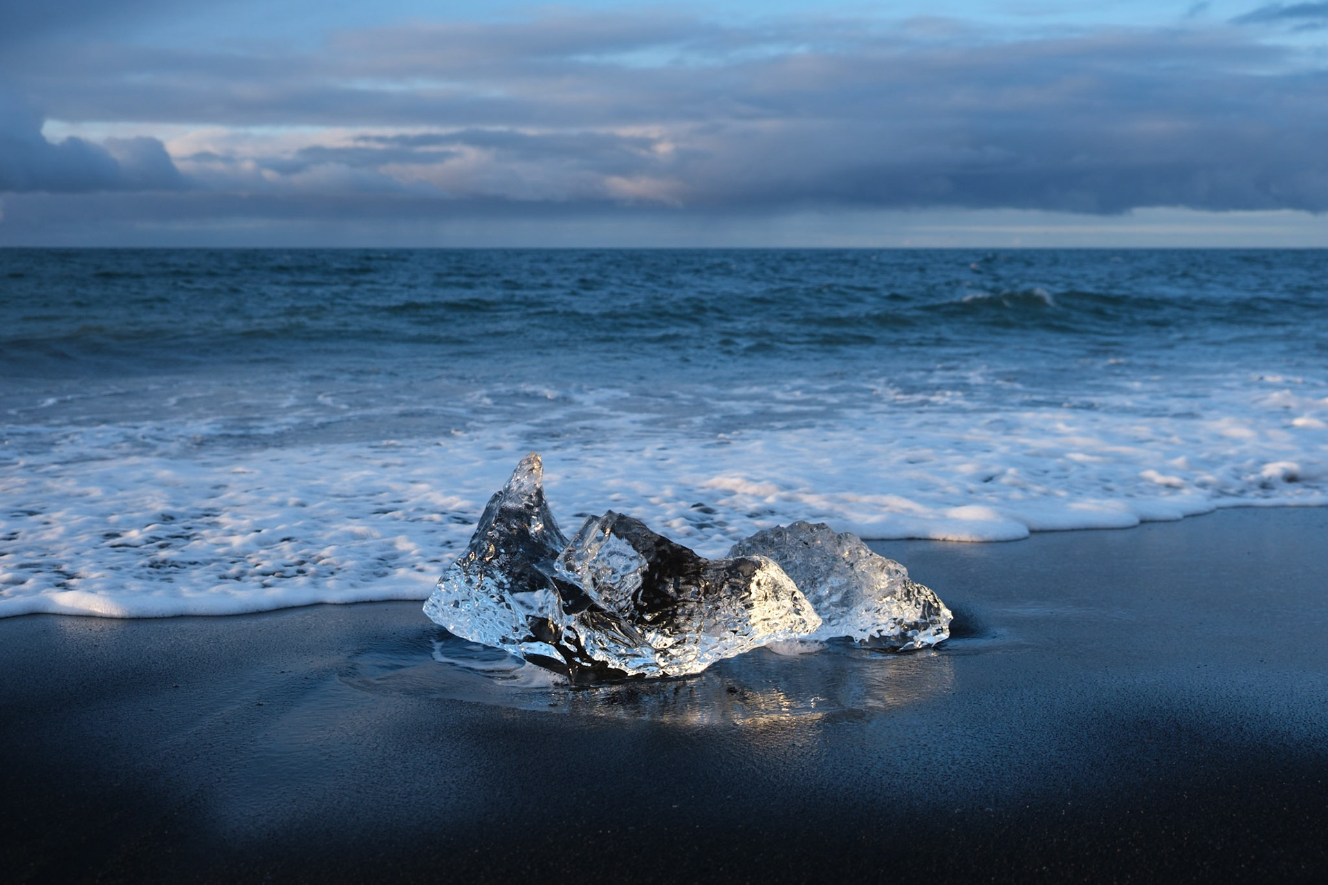 An iceberg on Jökulsárlón Ice Beach. The icebergs are washed out of Jökulsárlón lagoon at low tide and then wash up onto the beach on either side of the lagoon mouth.