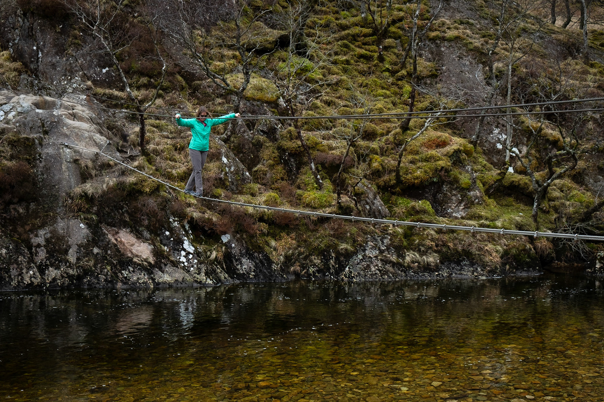 Testing out the suspension rope bridge at Steall Falls.