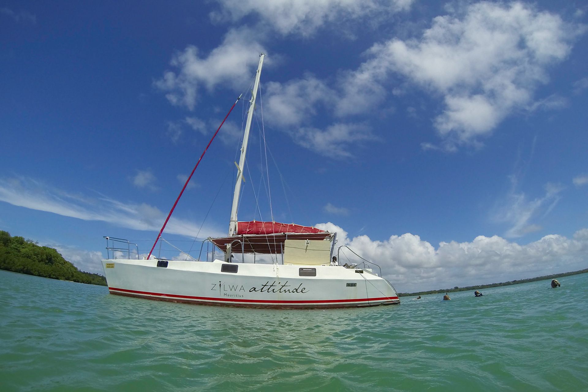 Swimming beside the Zilwa catamaran