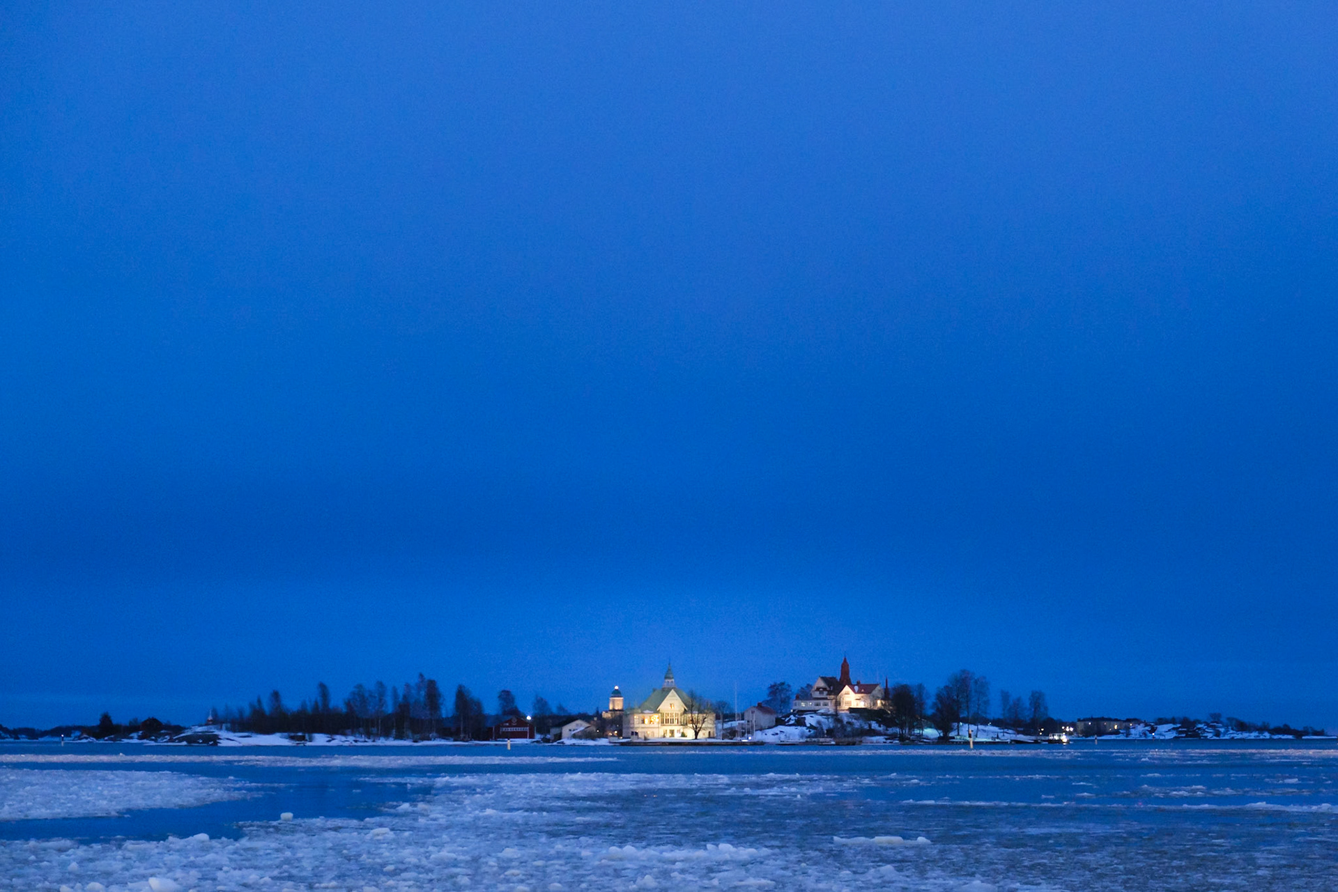 The view out to Valkosaari Island over the broken ice in Helsinki harbour, Finland