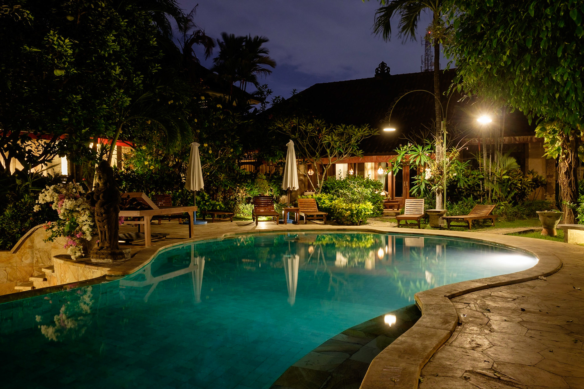 The Tamukami Hotel swimming pool at night, Sanur, Bali, Indonesia.