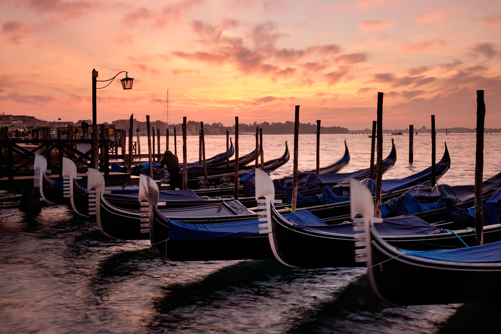 Sunrise over moored gondola's, San Marco, Venice.