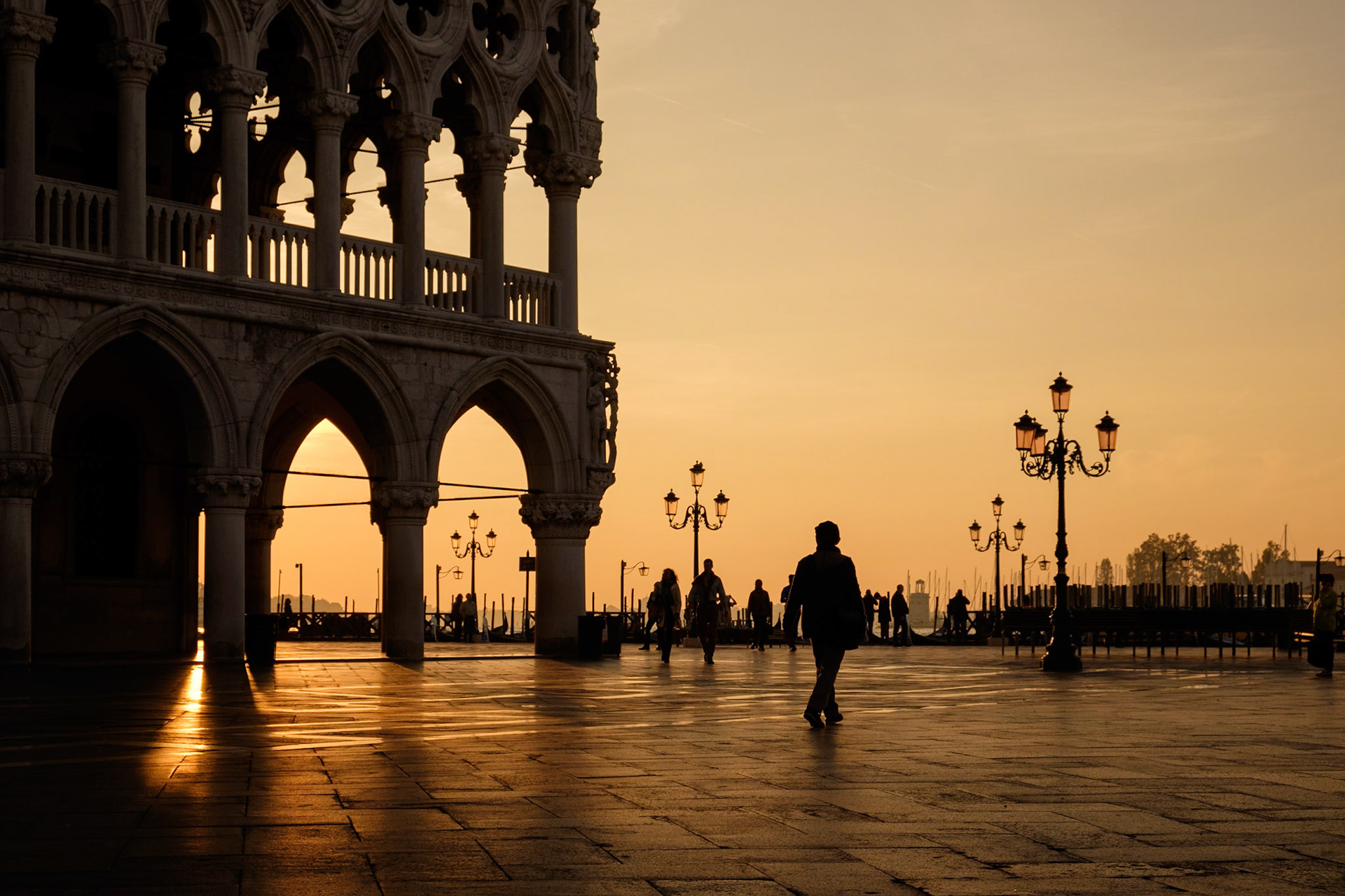 Sunrise behind Doge's Palace from Piazza San Marco, San Marco, Venice.