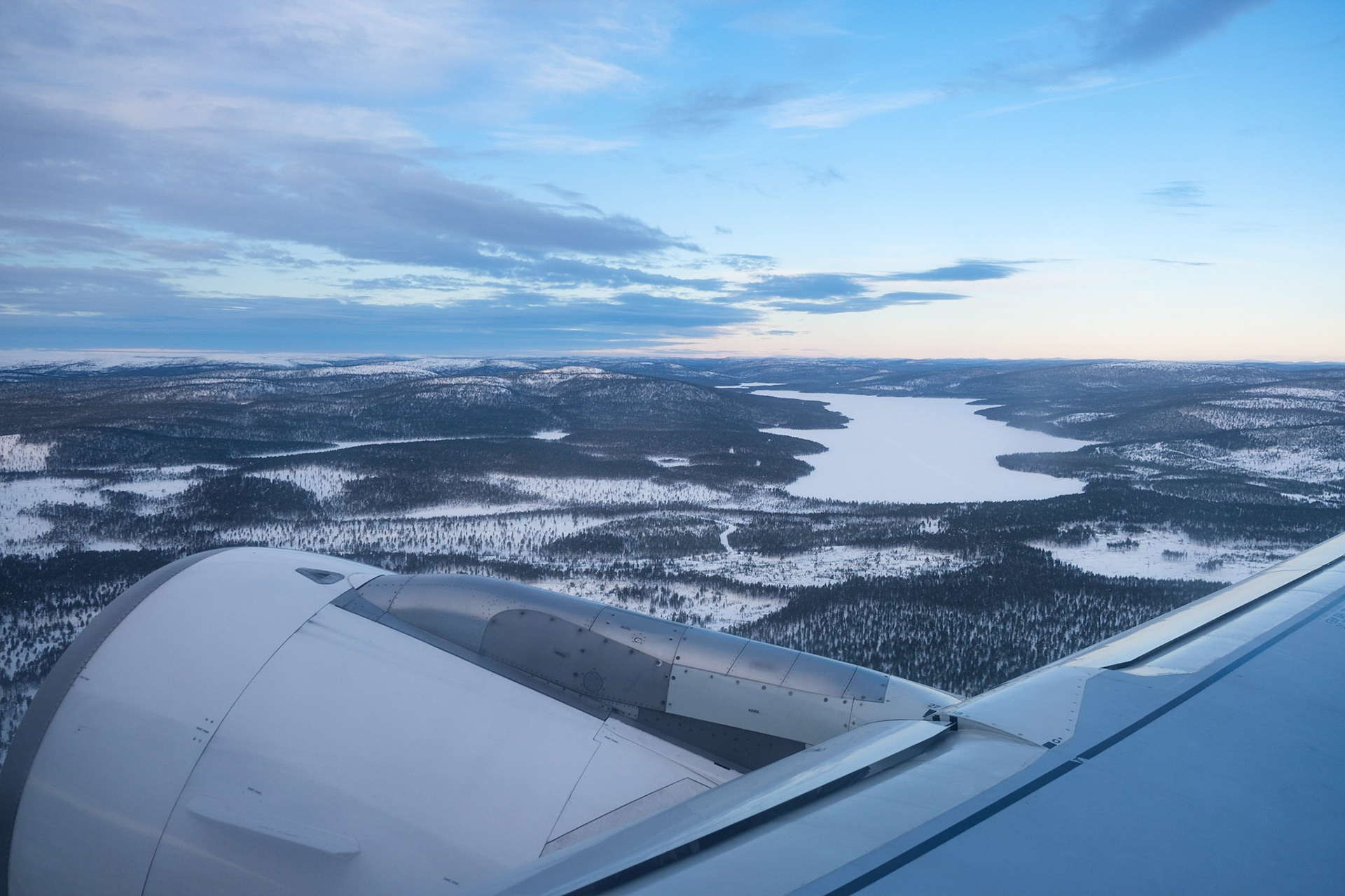 Fluing over the forests and frozen lakes as we leave Ivalo Airport bound for home, Nellim, Finnish Lapland.