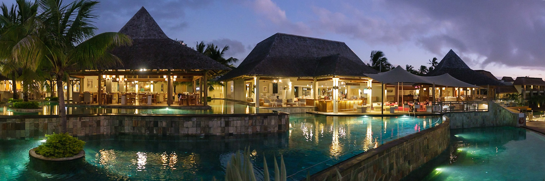 Zilwa restaurant and pool at dusk.