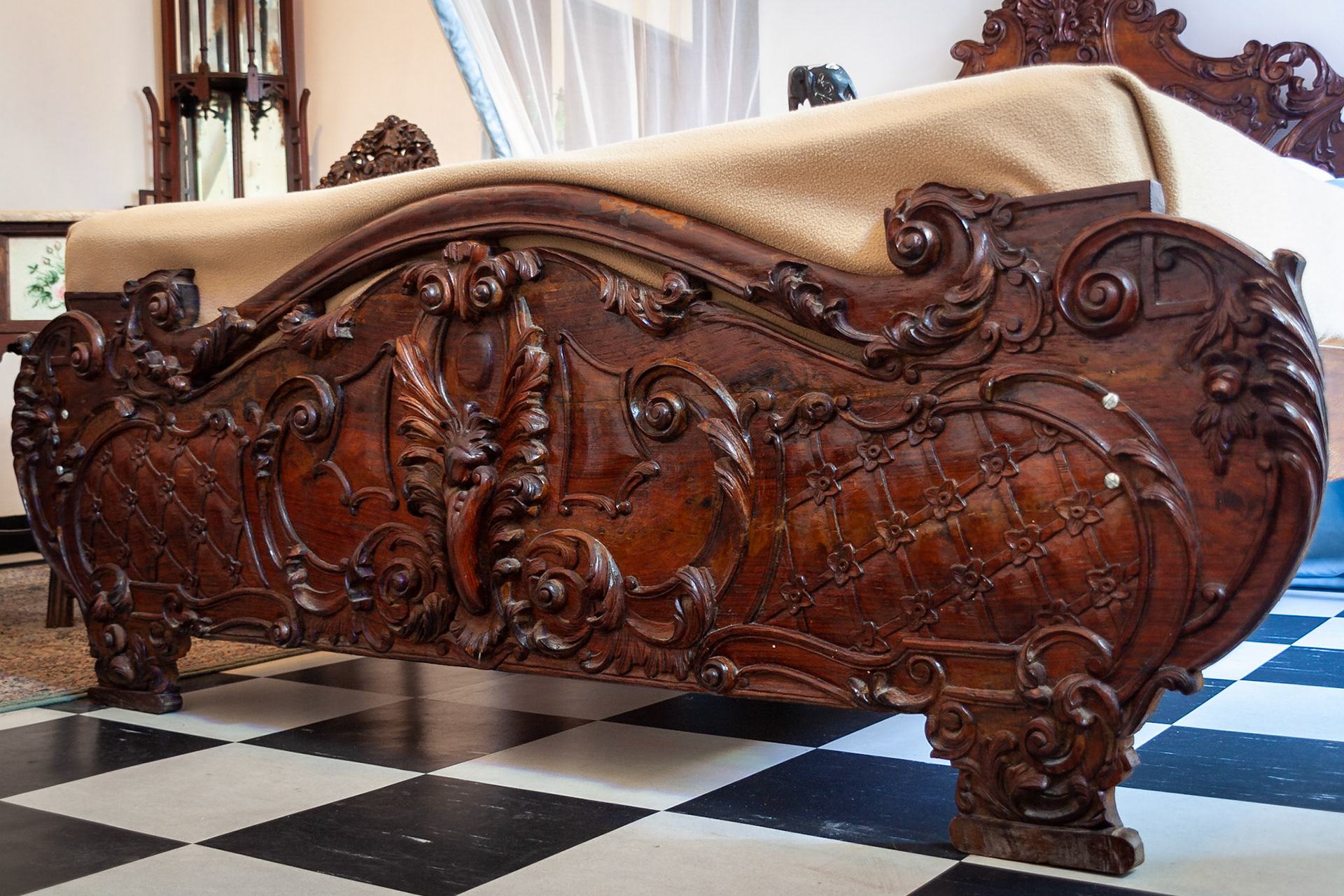 Carved wooden bed in Tembo Hotel, Stonetown, Zanzibar.