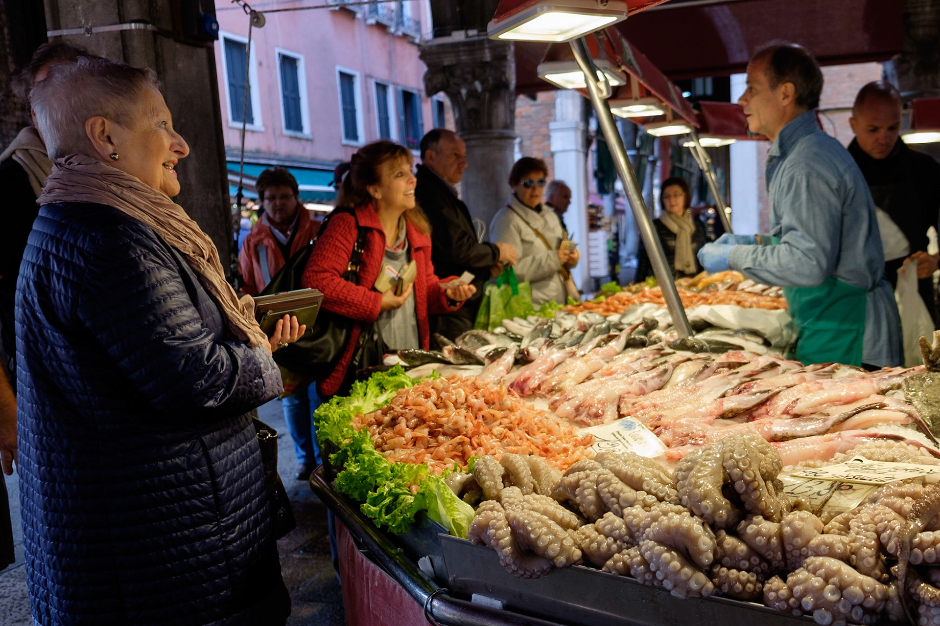 Venetians shop for their fresh fish in the early morning at the Rialto market, San Polo, Venice.