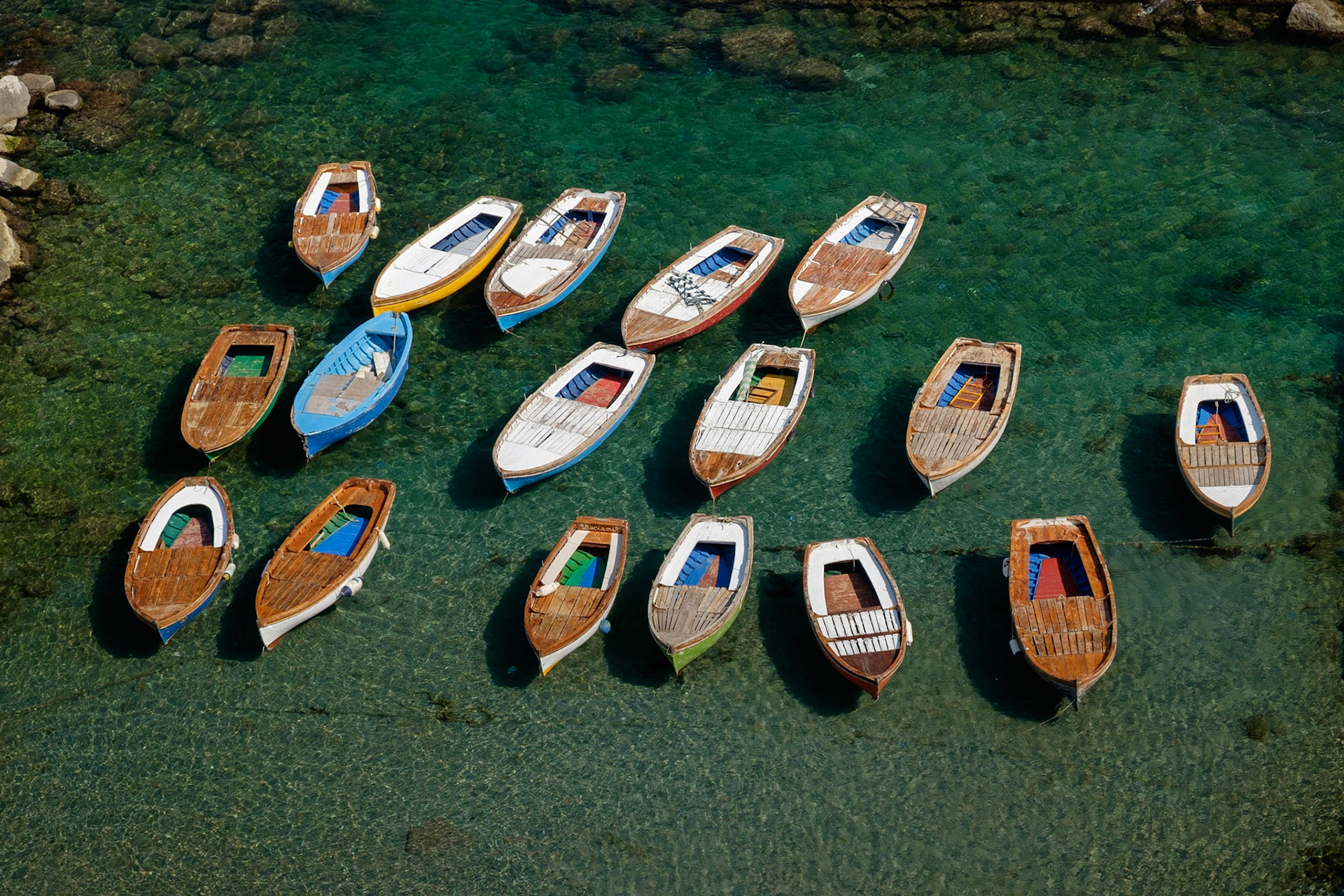 Fishing boats in a small harbour below Castel dell'Ovo, Naples.