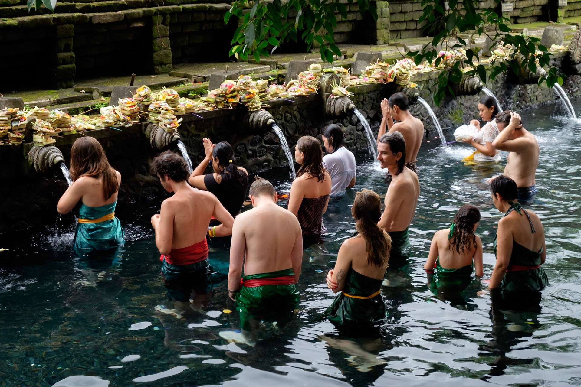 Bathing in the holy spring water at Tirta Empul, Ubud, Bali, Indonesia.