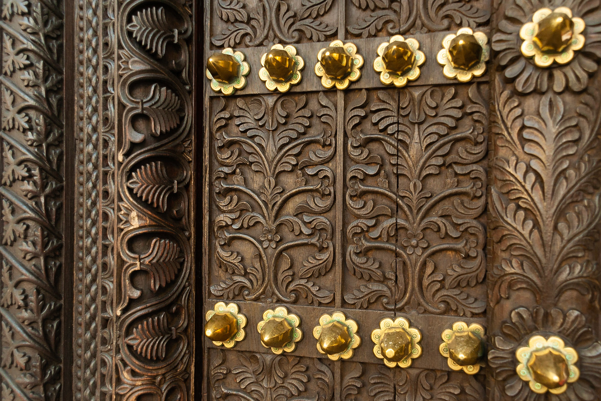 An intricately carved door adornes the entrance of Tembo Hotel, Stonetown, Zanzibar.