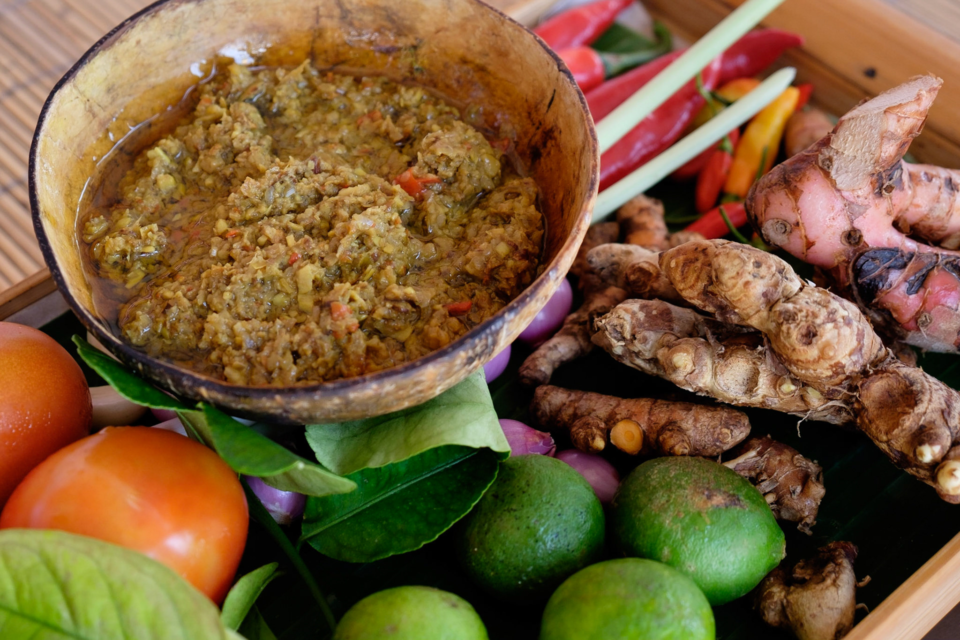 Bambu Bali paste, the basis of most balinese dishes, and the ingedients used to make it, Le Zat Restaurant, Candidasa, Bali, Indonesia.