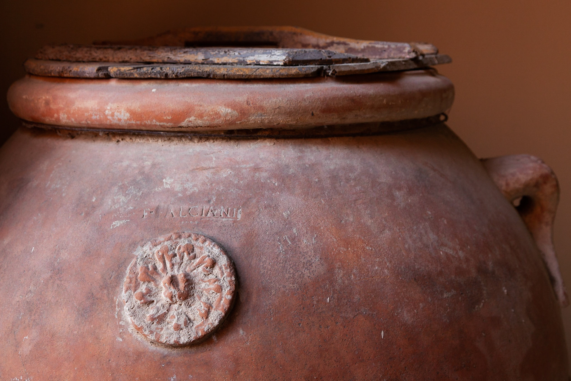 Huge pottery storage vats decorate Borgo di Colleoli, Tuscany, Italy.