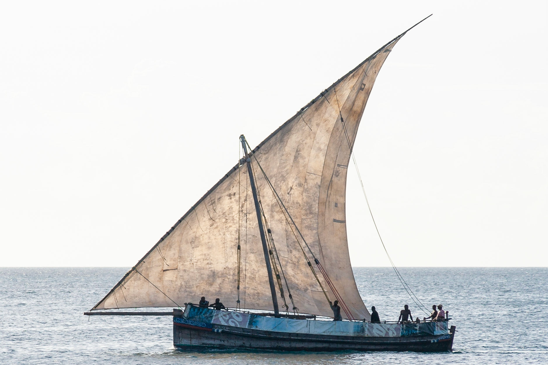 A dhow returns to harbour after a day of fishing, Stonetown, Zanzibar.