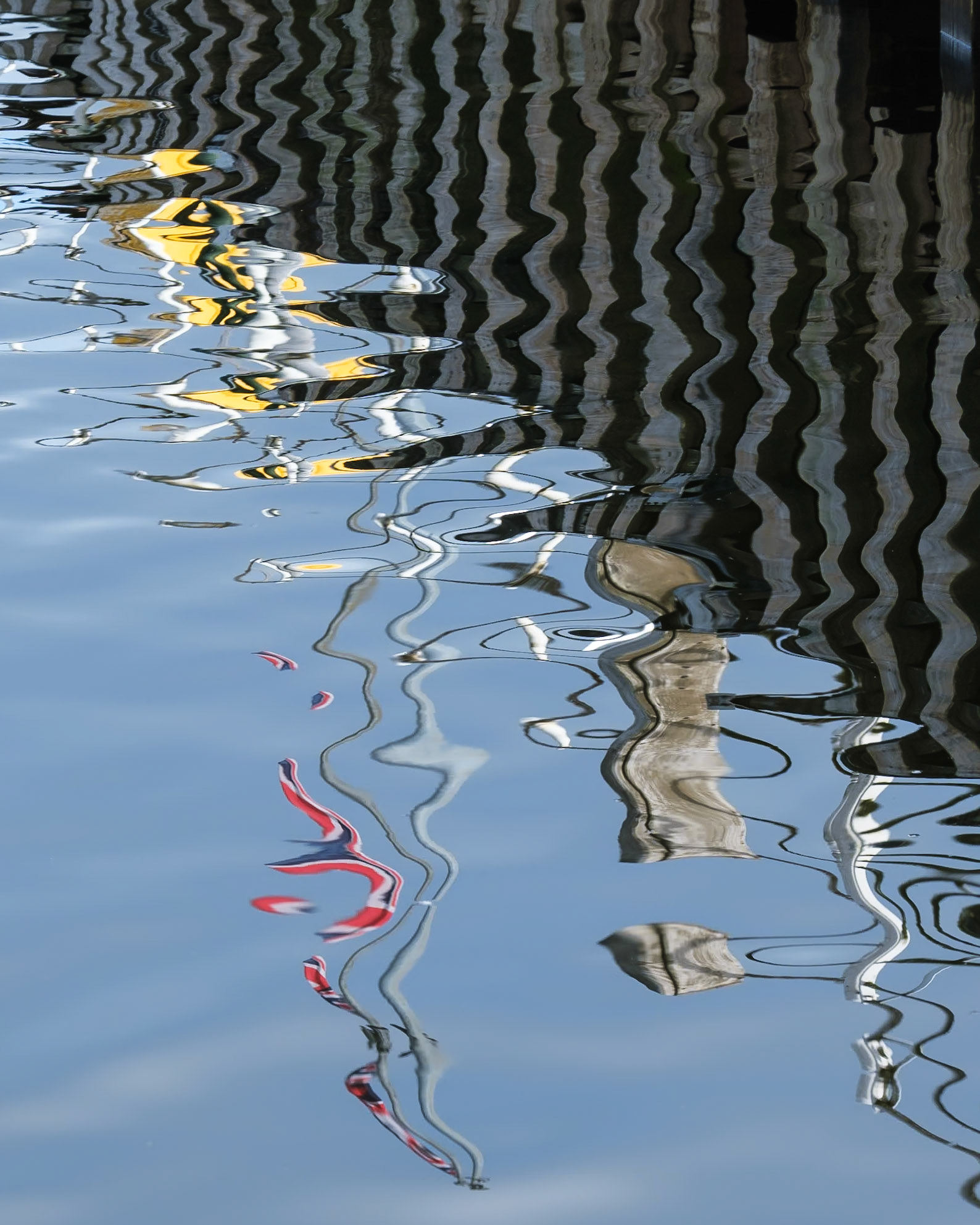 Reflections of the Glenridding pier on Ullswater.