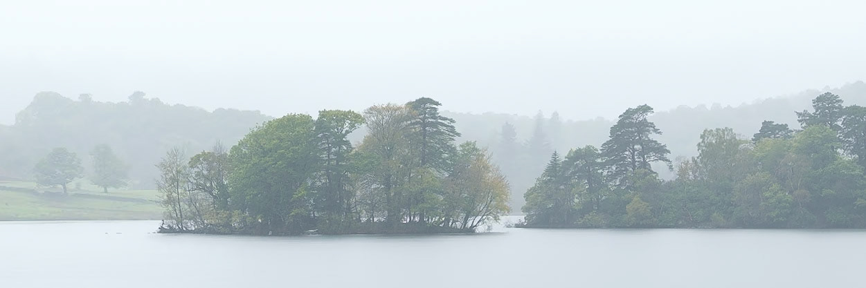 The islands of Rydal Water on a misty morning.