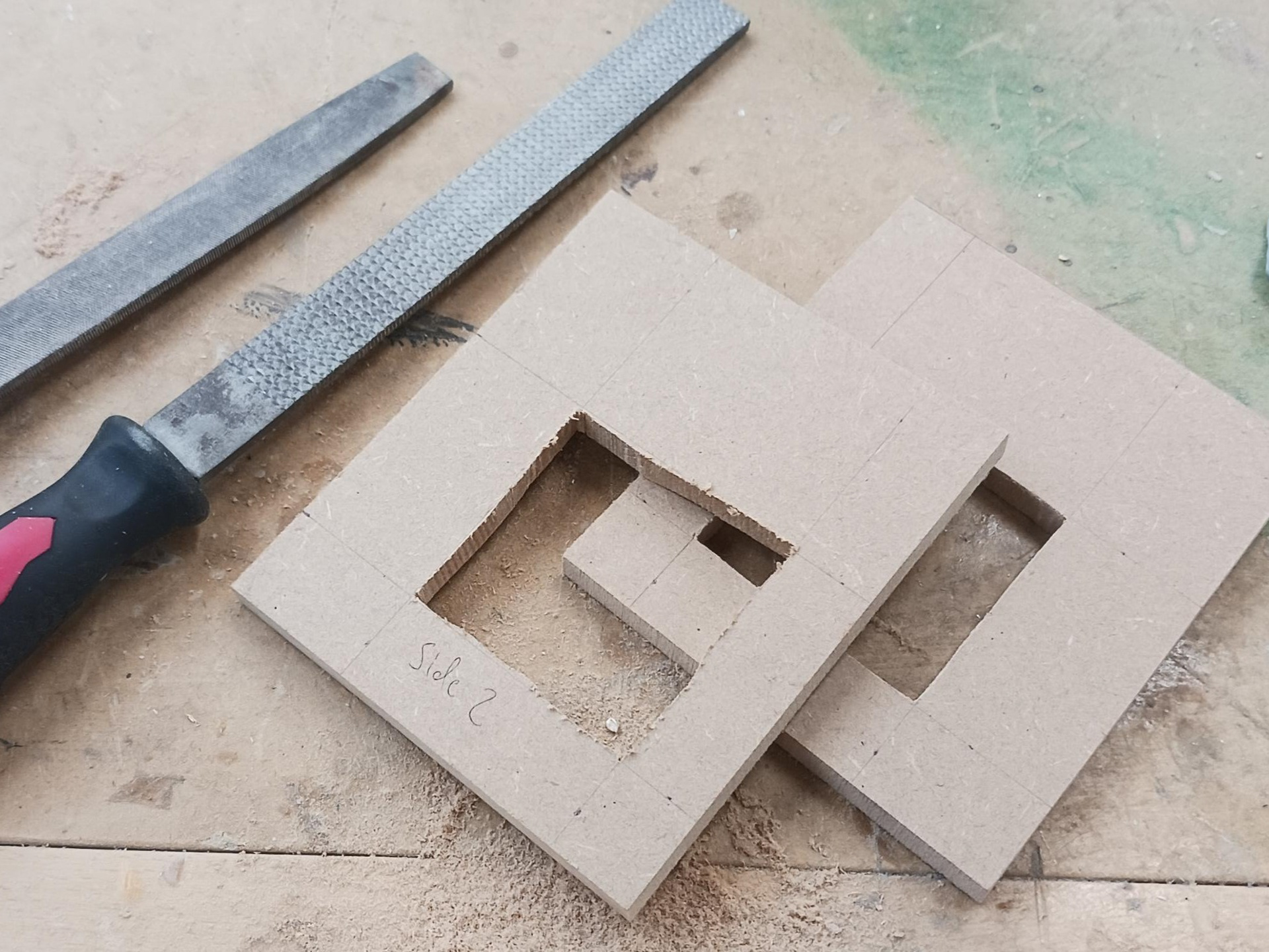 Cutting holes in the sides.