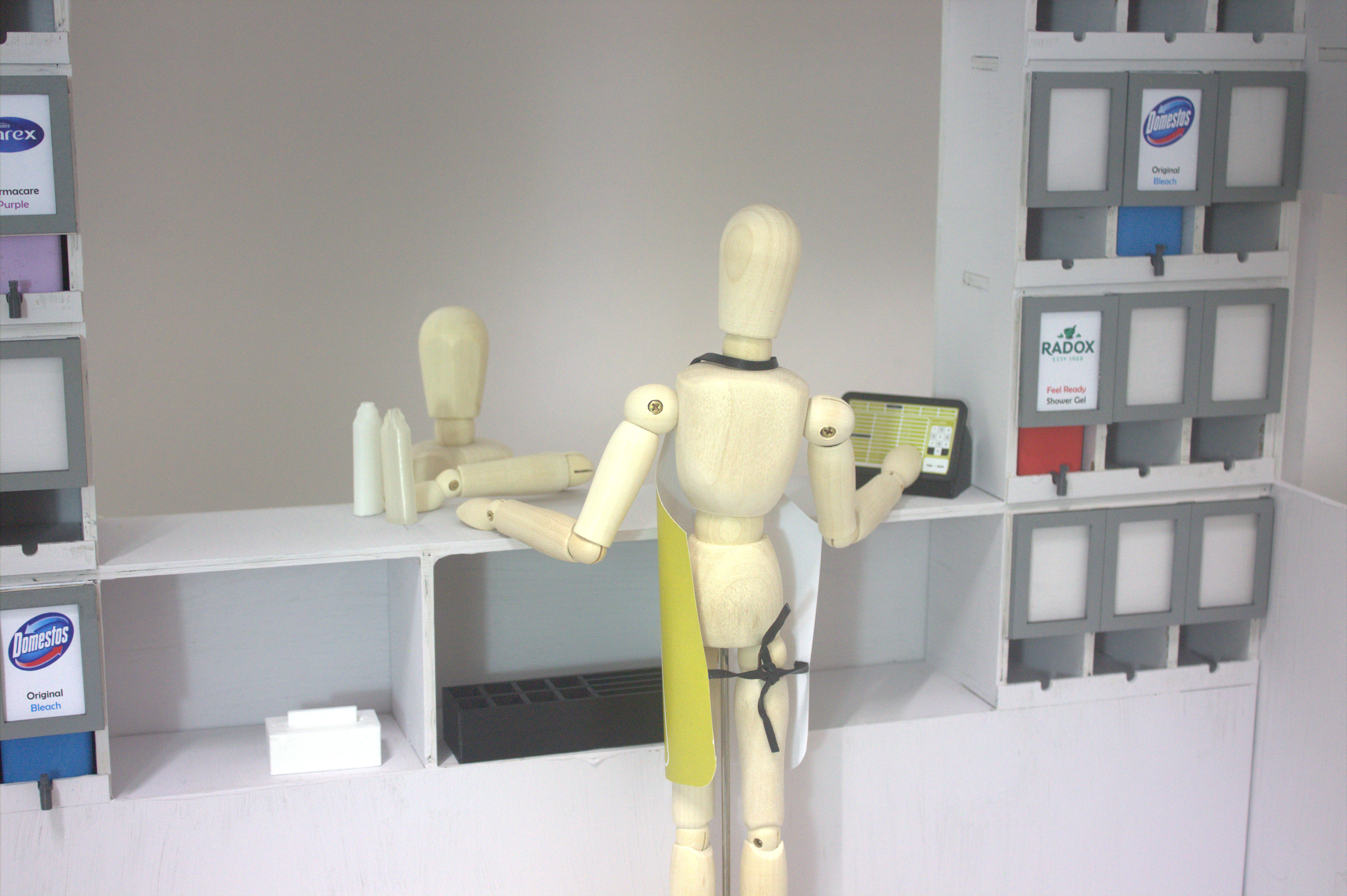 Worker using till.