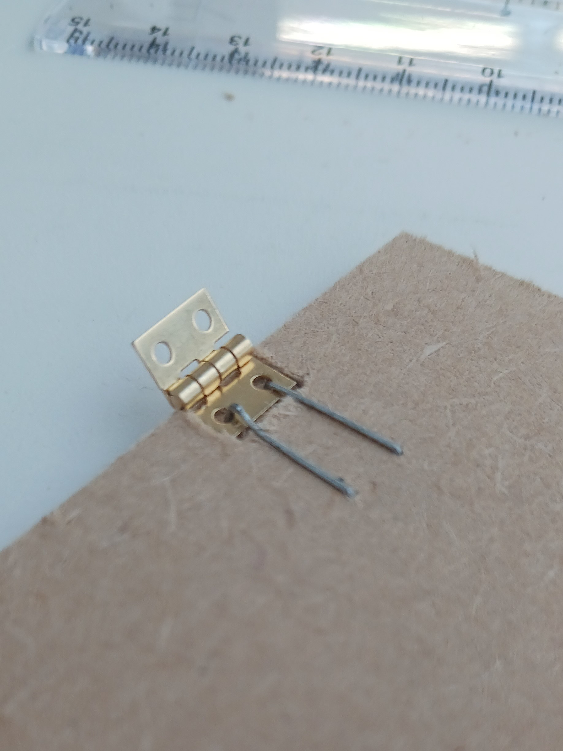 Glue did not work, changed to staples.