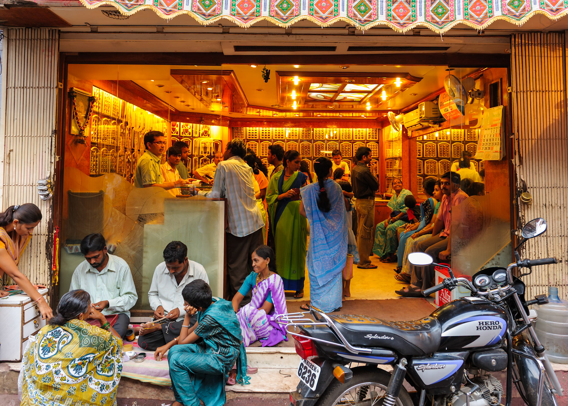 Pune, India 9/26/2010 --- Gold shops crowded for festive purchase.  People are flooded with booking for gold during the ongoing Ganesh/Ganpati festival.  To ensure delivery, many Pune residents are making prior booking.  Besides, gold rates are anticipated to be high in India and so rush at the jewelry shops is more.