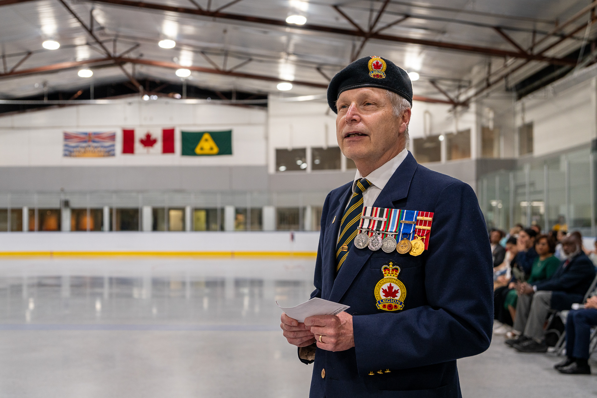 Documentary portrait of a Canadian veteran in an in-door ice rink captured on a Sony A1, processed with Adobe Standard profile.