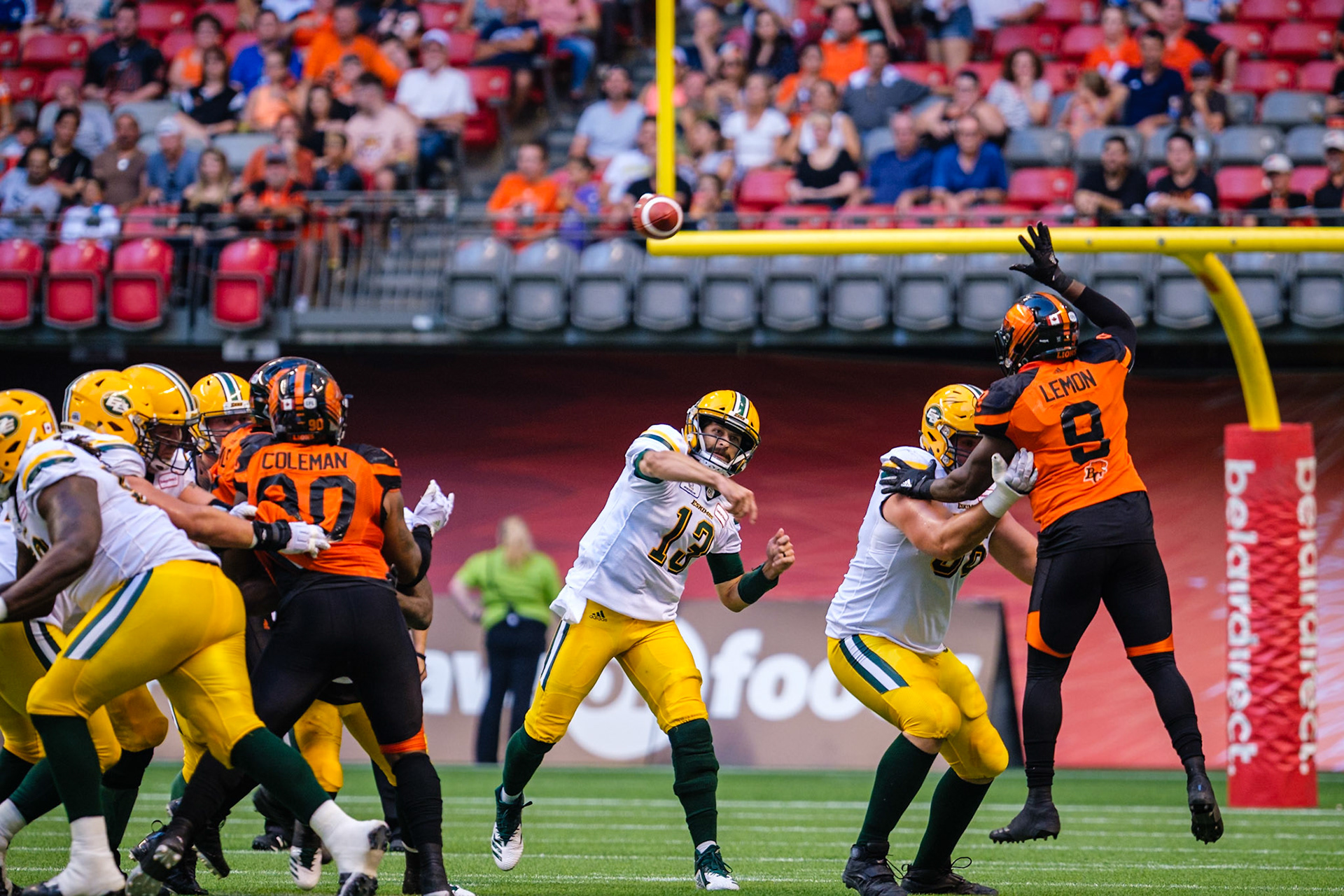 Edmonton Eskimos quarterback Mike Reilly, centre, passes against the B.C. Lions in Vancouver on Thursday, August 9, 2018.