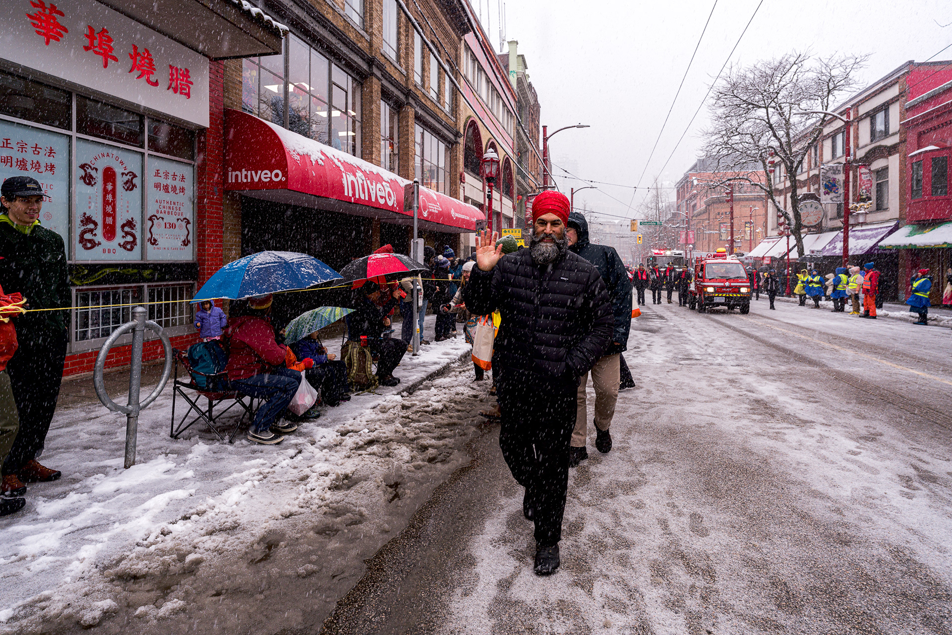 Jagmeet Singh walking through snow at Vancouver parade.