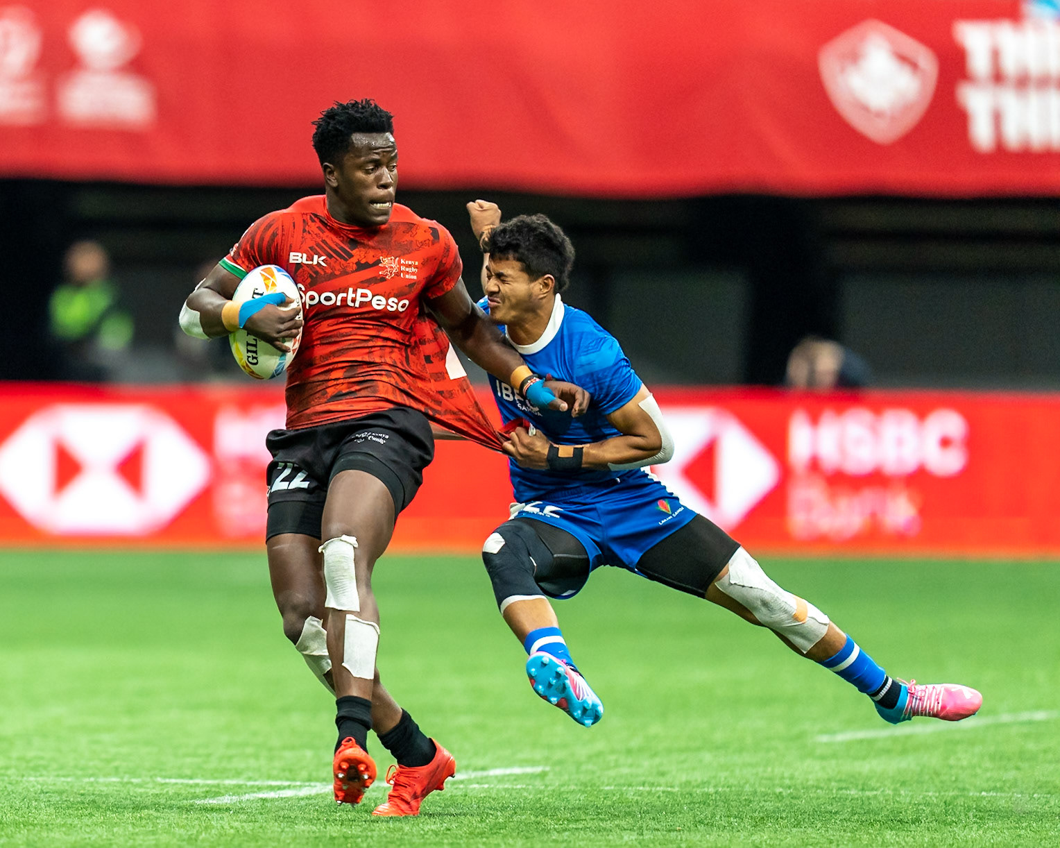 Vancouver, Canada. 5th March, 2023. John Okeyo of Kenya (L) fends off the tackle during Day 3 - HSBC Canada Sevens 2023 against Samoa at BC Place in Vancouver, Canada. Credit: Joe Ng/Alamy Live News.