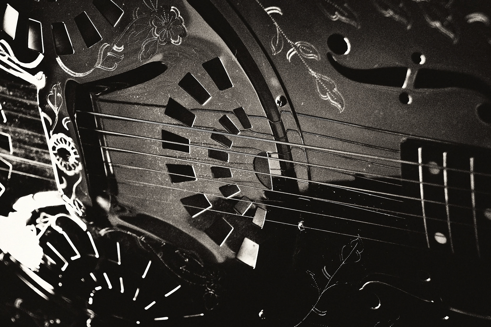 A photo from my Dobro series. The Engraving detail is quite nice on this metal bodied guitar.