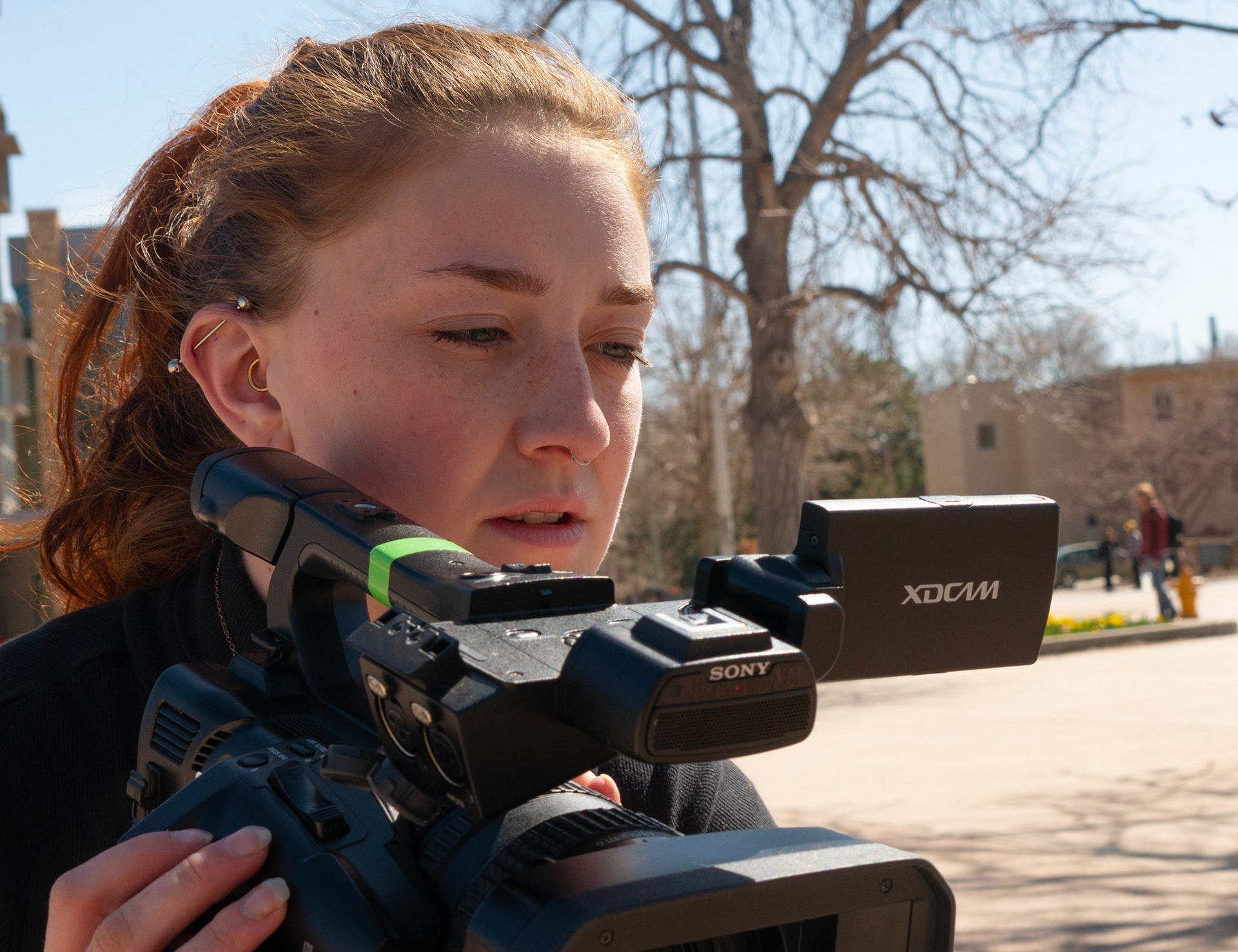 CTV Reporter Ren Wadsworth gets in close to her camera to focus on what she is shooting on the Plaza at Colorado State University on April 4th, 2022.
