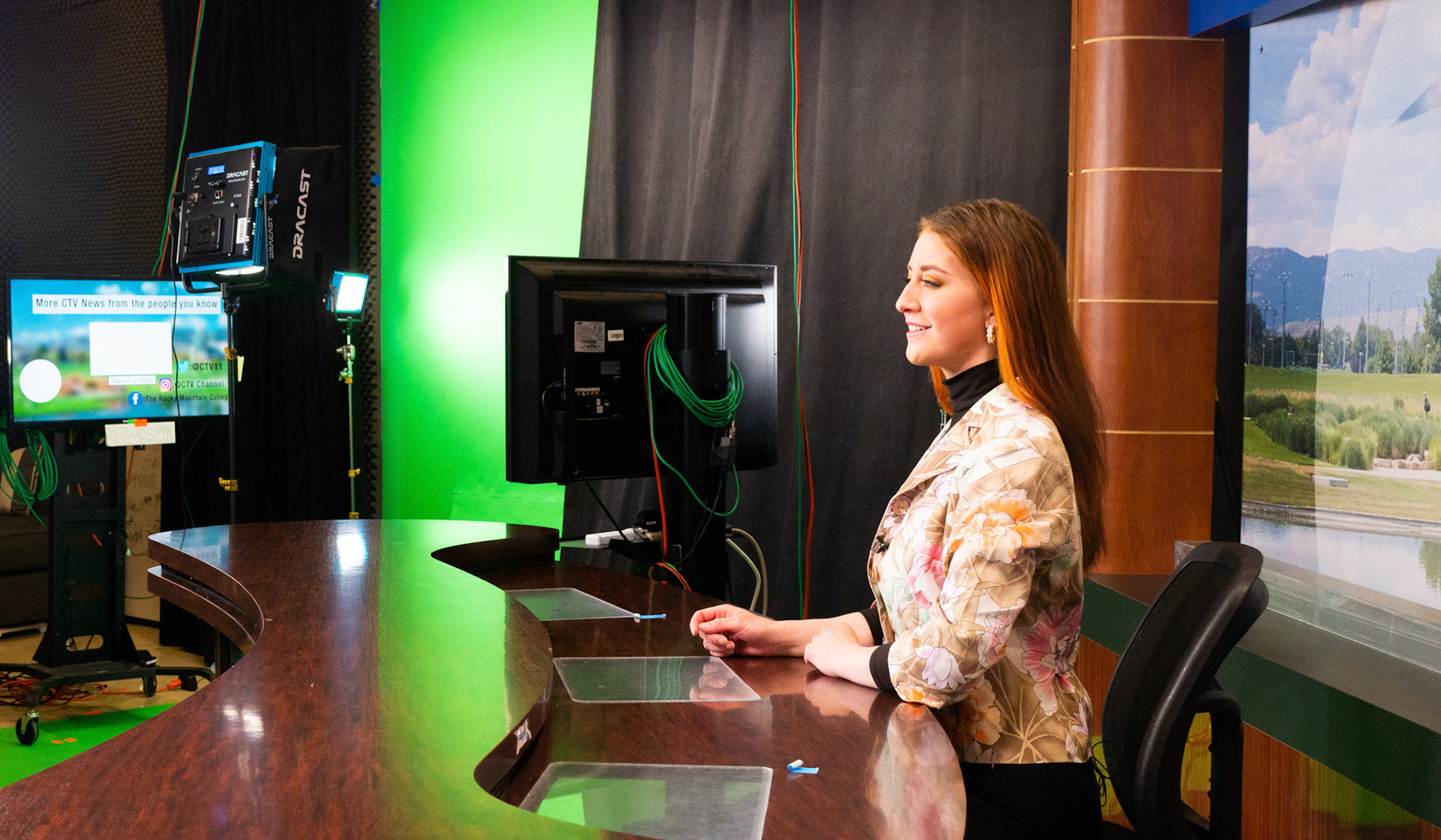 Ren Wadsworth fixes her posture while a camera is framed on her during preparation for the News Broadcast in the TV studio at Colorado State University, on April 5th, 2022.