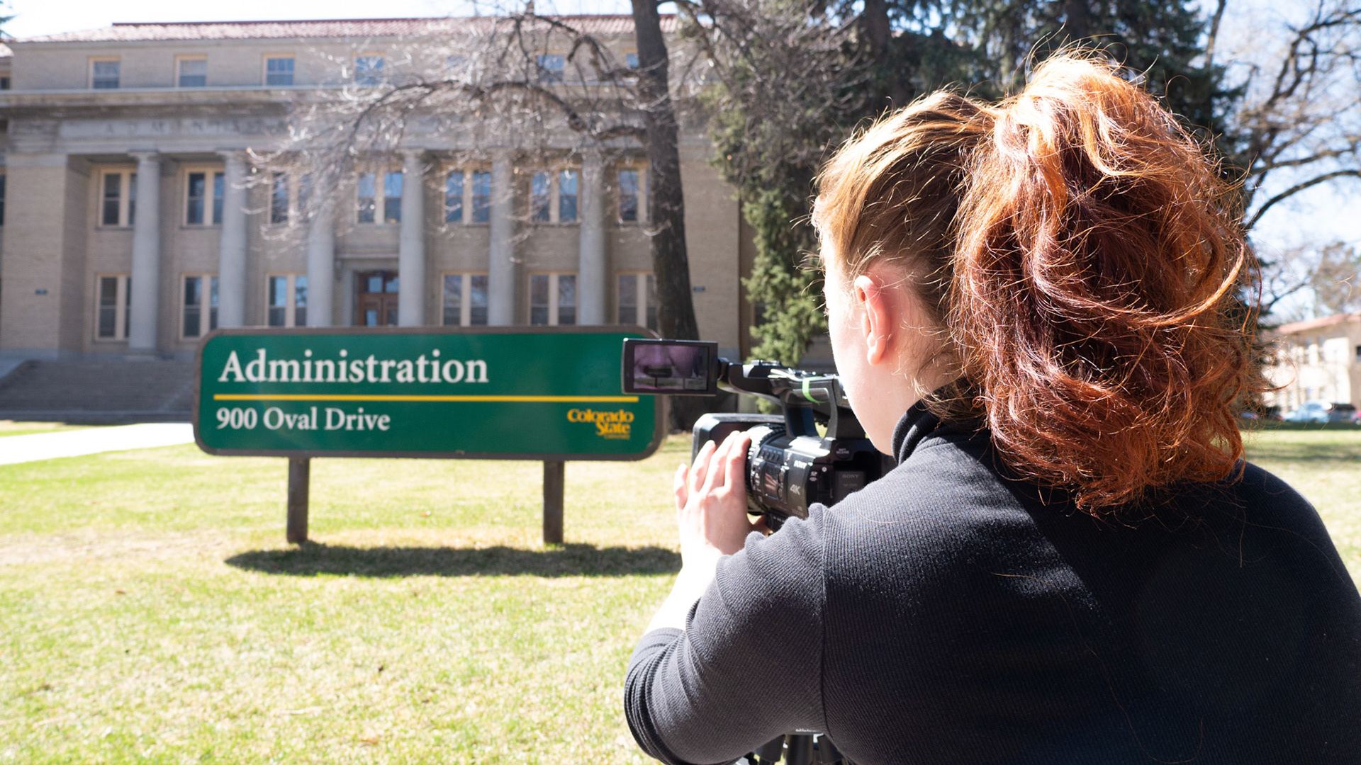 Ren Wadsworth shoots the sign of the Administration Building at Colorado State University on April 4th, 2022.