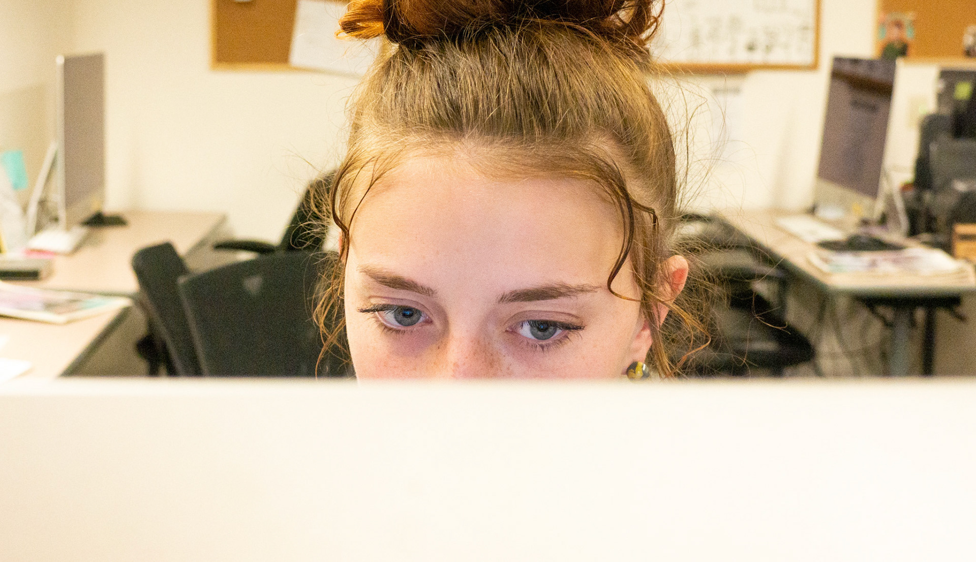 Ren Wadsworth concentrates on an edit in the Newsroom at the Lory Student Center at Colorado State University on May 2nd, 2022.