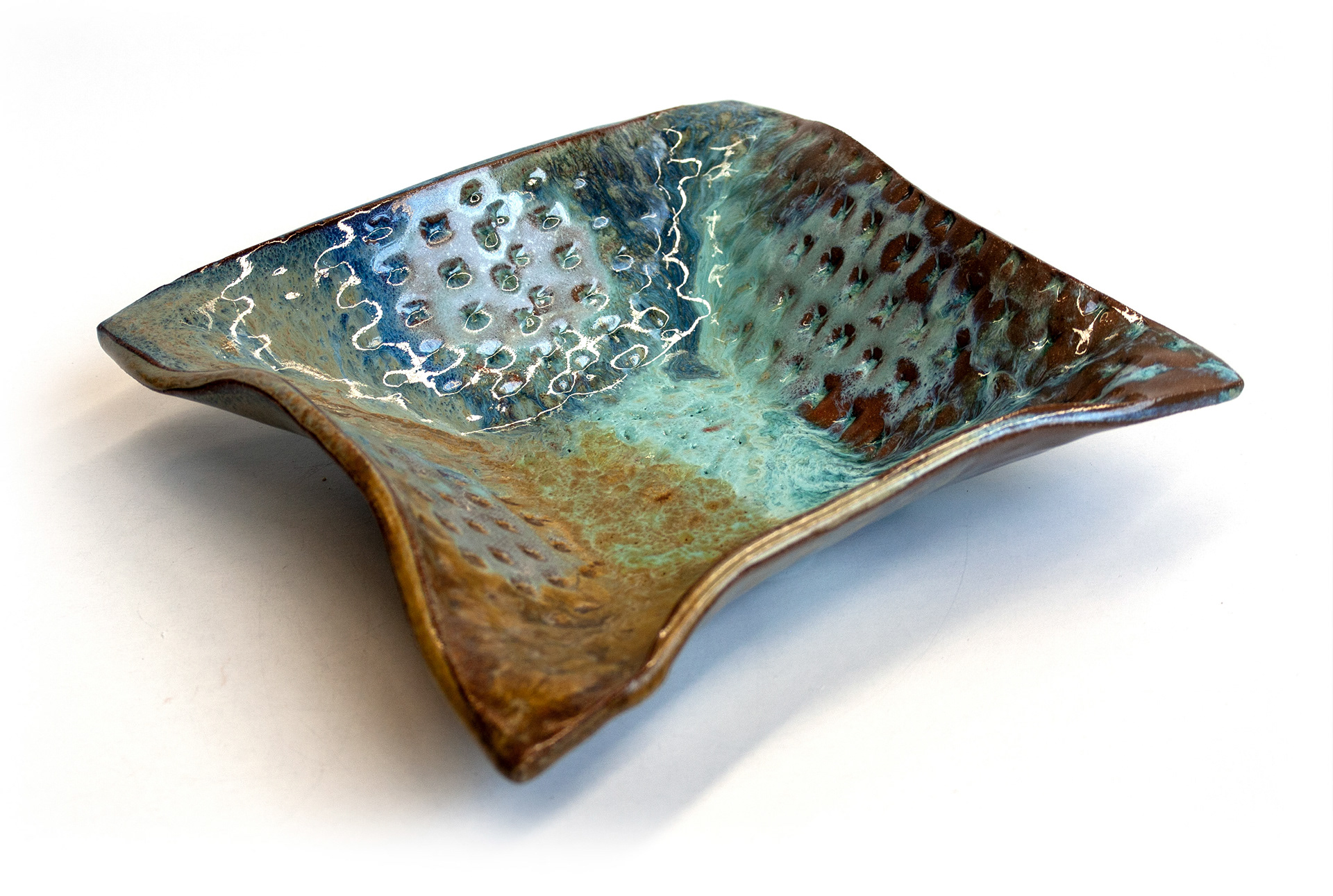 Pressed with 3D printed stamps, then draped over a premade plaster mold (2021)