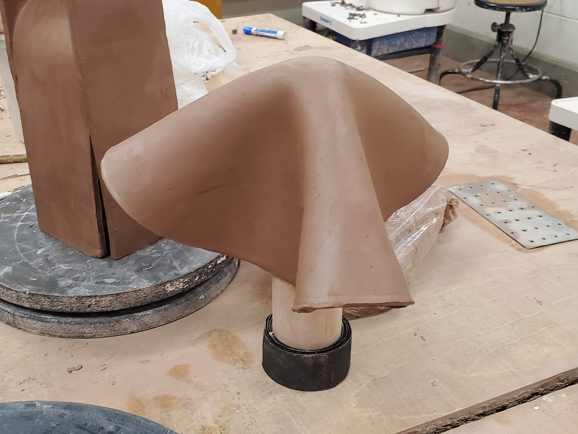 Using a found object: the wooden roller.