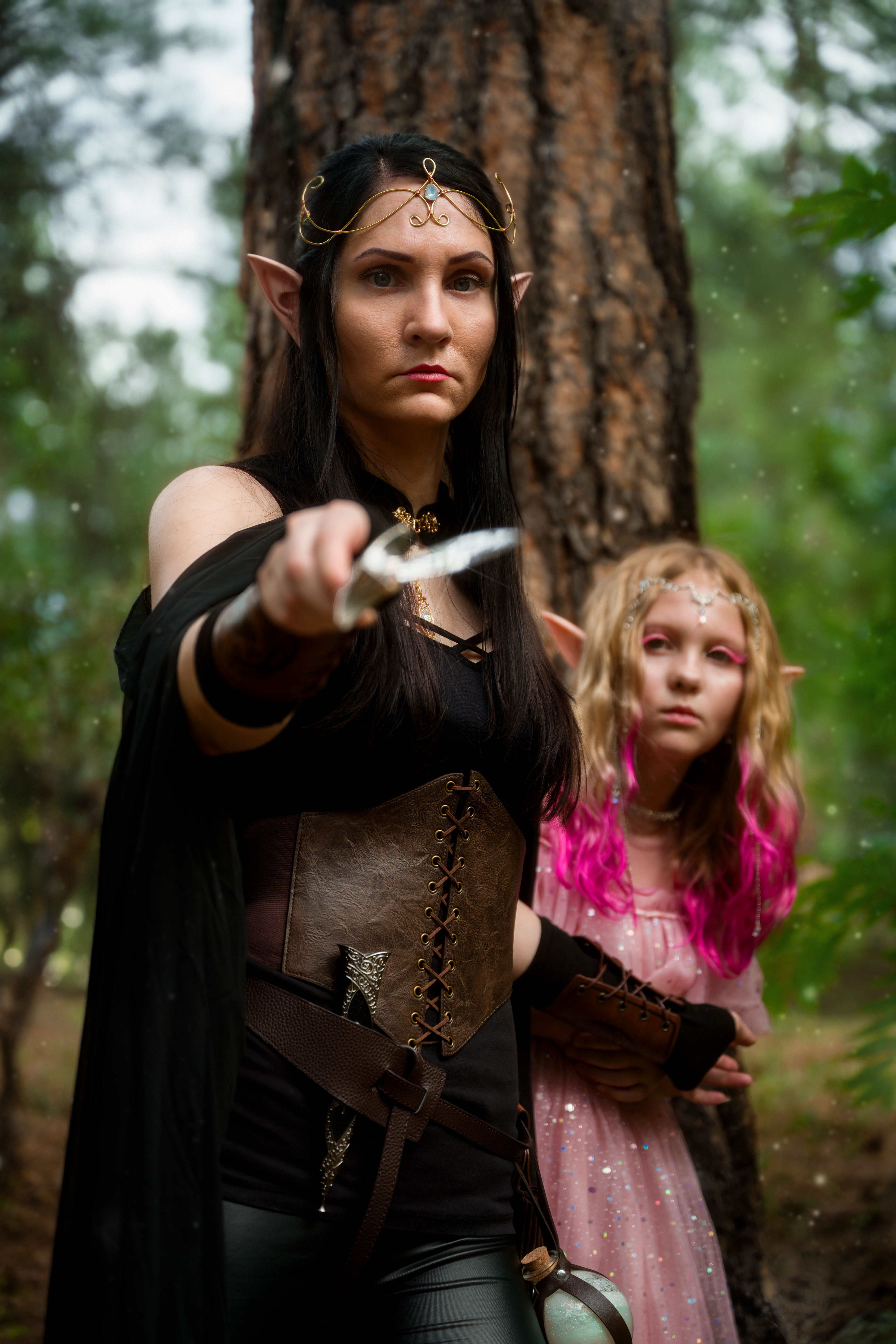 "Guarding The Princess"  There is no greater honor that can be bestowed than the one given to Meaghen. “Guard her with your life” she was told by the king. Meaghen does not take this charge lightly,  holding this weight deep on her heart. This delicate, cheerful, kindhearted princess looks up over her shoulder at Meaghen after taking a sip of water. Little does she know the heavy responsibilities that await her upon their arrival. But those concerns can wait. They must first make their way though these woods safely. No matter what they face one thing is for sure. Meaghen will guard this precious princess  with her strength, power, and life. 