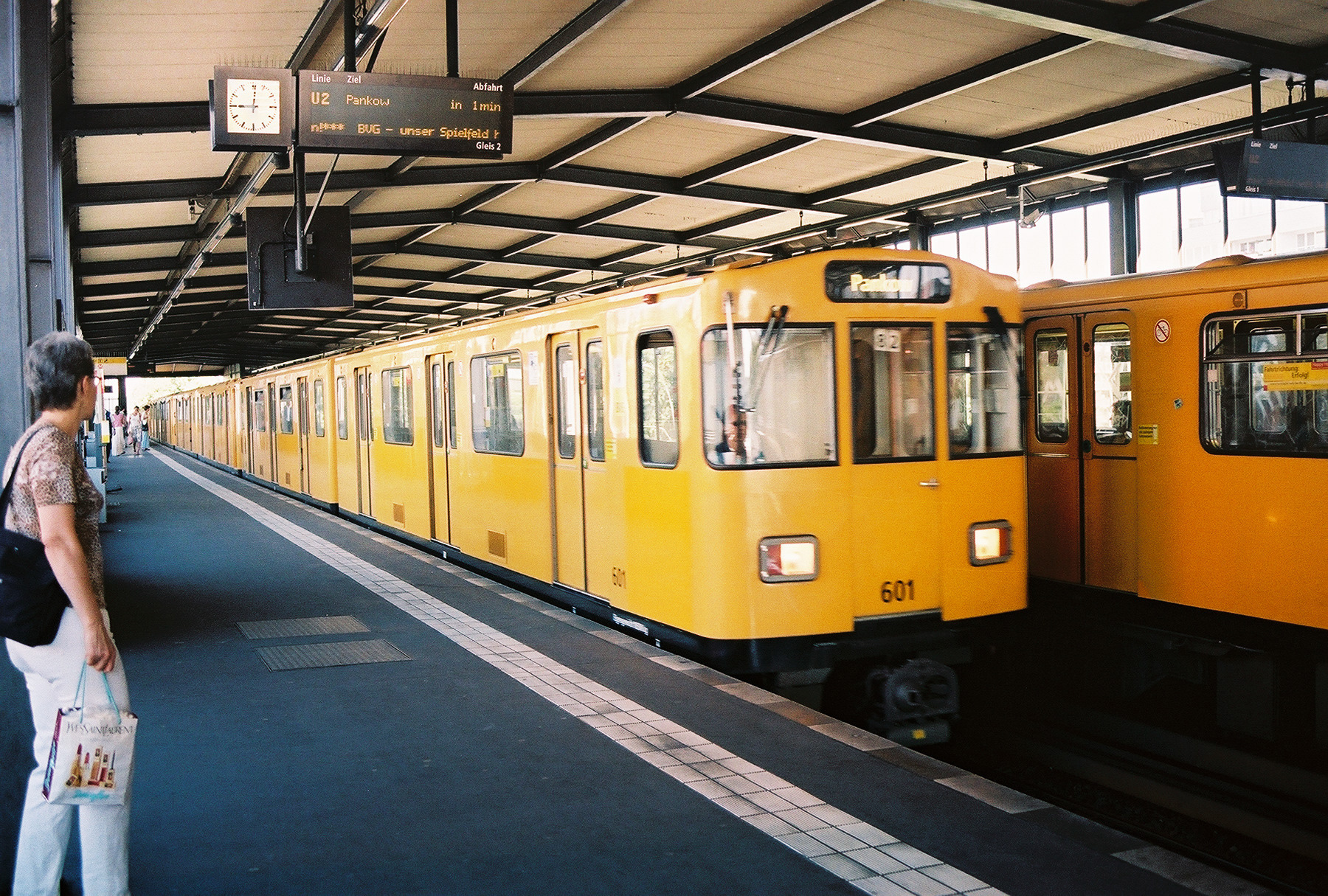 German U-Bahn underground train travels through over ground station Berlin Germany
