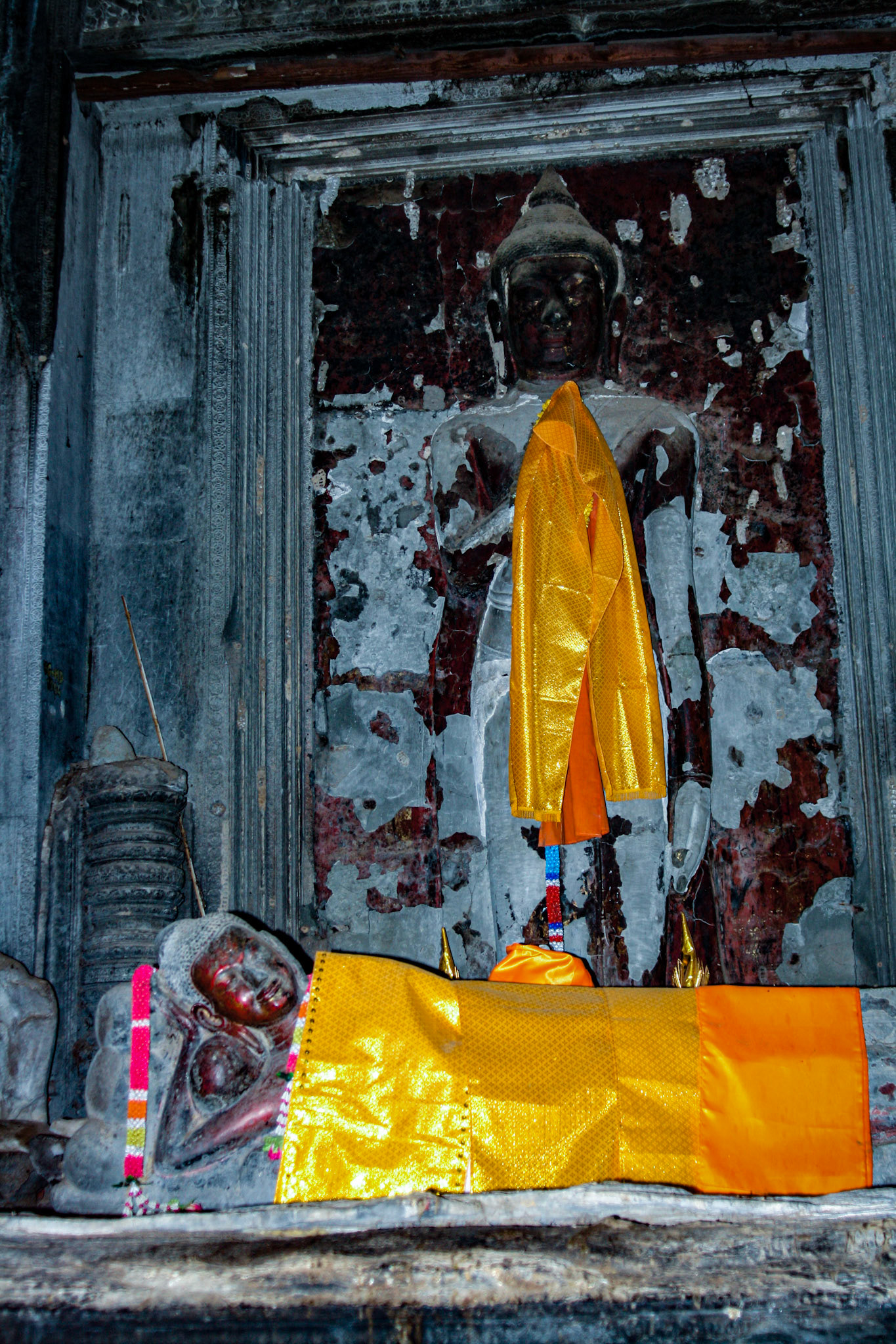 Buddhism proliferated in the Cambodian region during the 13th century. Gradually, it became the dominant religion of Cambodia and Angkor Wat, along with other Hindu monuments, were repurposed for Buddhist worship. Buddhist iconography was added alongside the existing Hindu symbols and sculptures of Buddha were erected. The temple continues to be used for Buddhist worship to this day. 