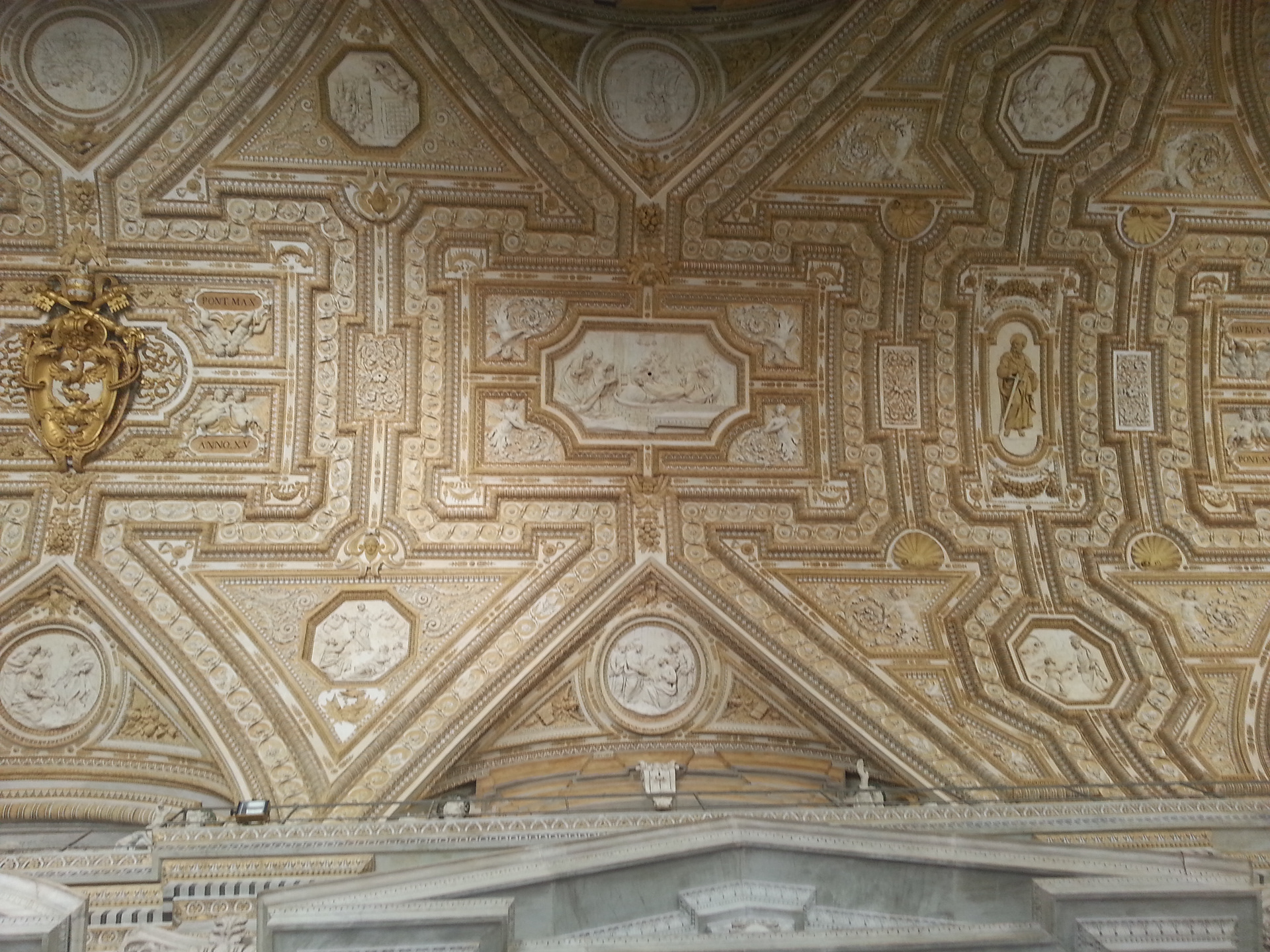 Portico - St Peter's Basilica - The ceiling is decorated with stuccoes of scenes from the life of St Peter, and in the lunettes are thirty-eight statues of Sainted Popes. 