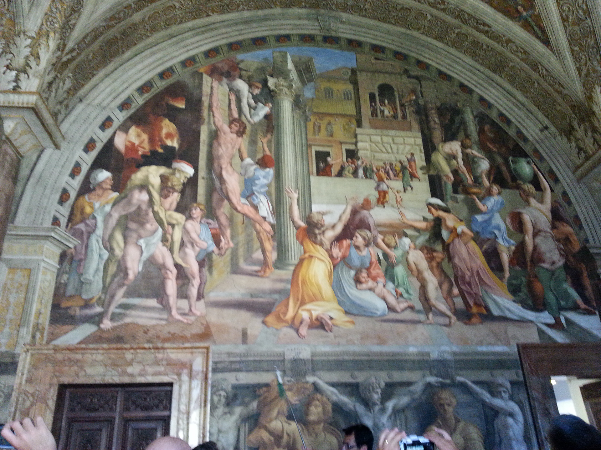 The Fire in the Borgo is a painting created by the workshop of the Italian Renaissance artist Raphael between 1514 and 1517. Though it is assumed that Raphael did make the designs for the complex composition, the fresco was most likely painted by his assistant Giulio Romano. The painting was part of Raphael's commission to decorate the rooms that are now known as the Stanze di Raffaello, in the Apostolic Palace in the Vatican. It depicts Pope Leo IV halting a fire in 847 with a benediction from a balcony in front of the Old St. Peter's Basilica. The mural lends its name to the Stanza dell'incendio del Borgo ("The Room of the Fire in the Borgo"). 