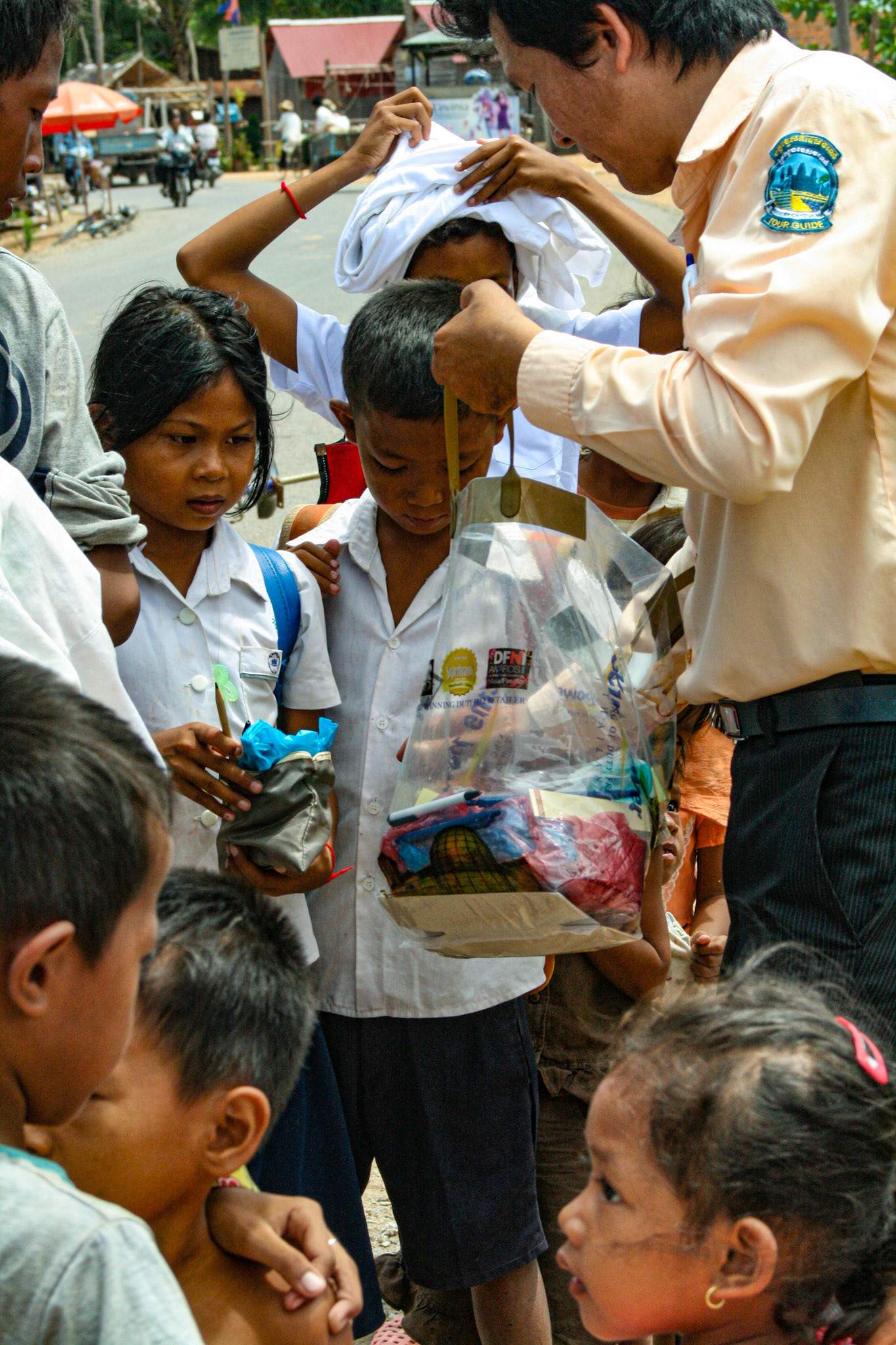 Our tour guide delivers varied and sundry gifts to some local villagers. Clothes, hygiene products, paper goods and other small items are among some of the items he collects for each time he visits. 