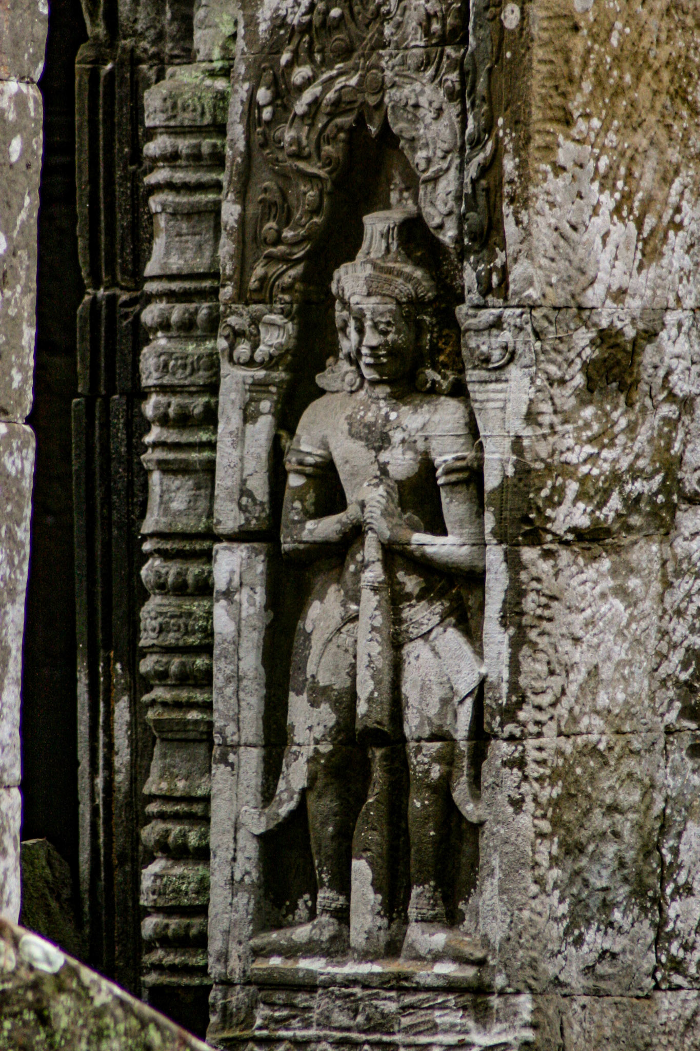 Ta Prohm does not have as many narrative bas-reliefs as Angkor Wat or Angkor Thom, but some depictions of scenes from Buddhist mythology do remain. The temple also features stone reliefs of devatas (minor female deities), meditating monks or ascetics, and dvarapalas or temple guardians. 