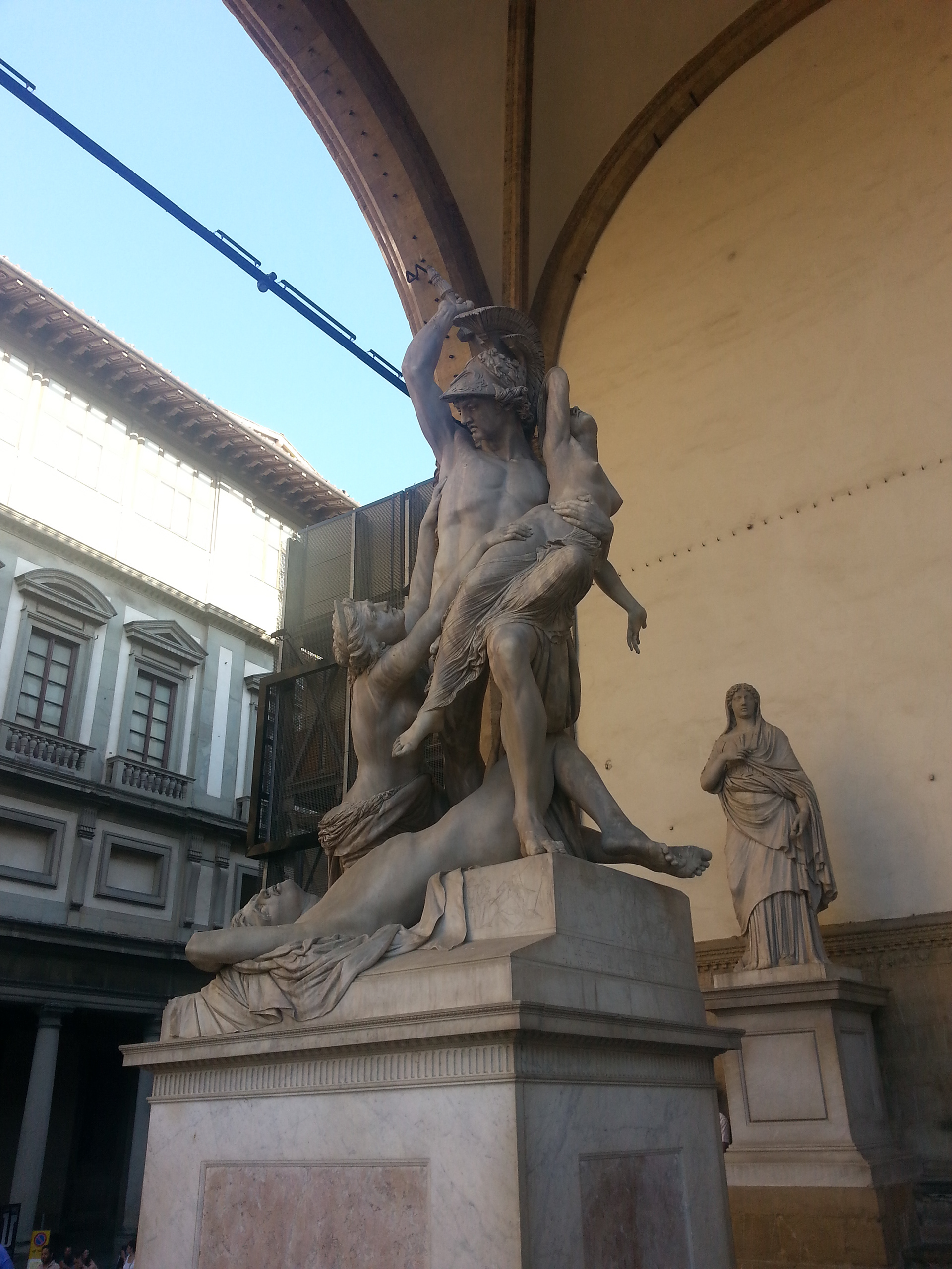 Polyxena was the daughter of King Priam and Queen Hecuba of Troy. Achilles fell in love and wished to marry her. One story relates that she helped set up his murder and another tells that he died in battle. Achilles ghost demanded Polyxena's sacrifice on his tomb. This sculpture shows the Greeks seizing her. 