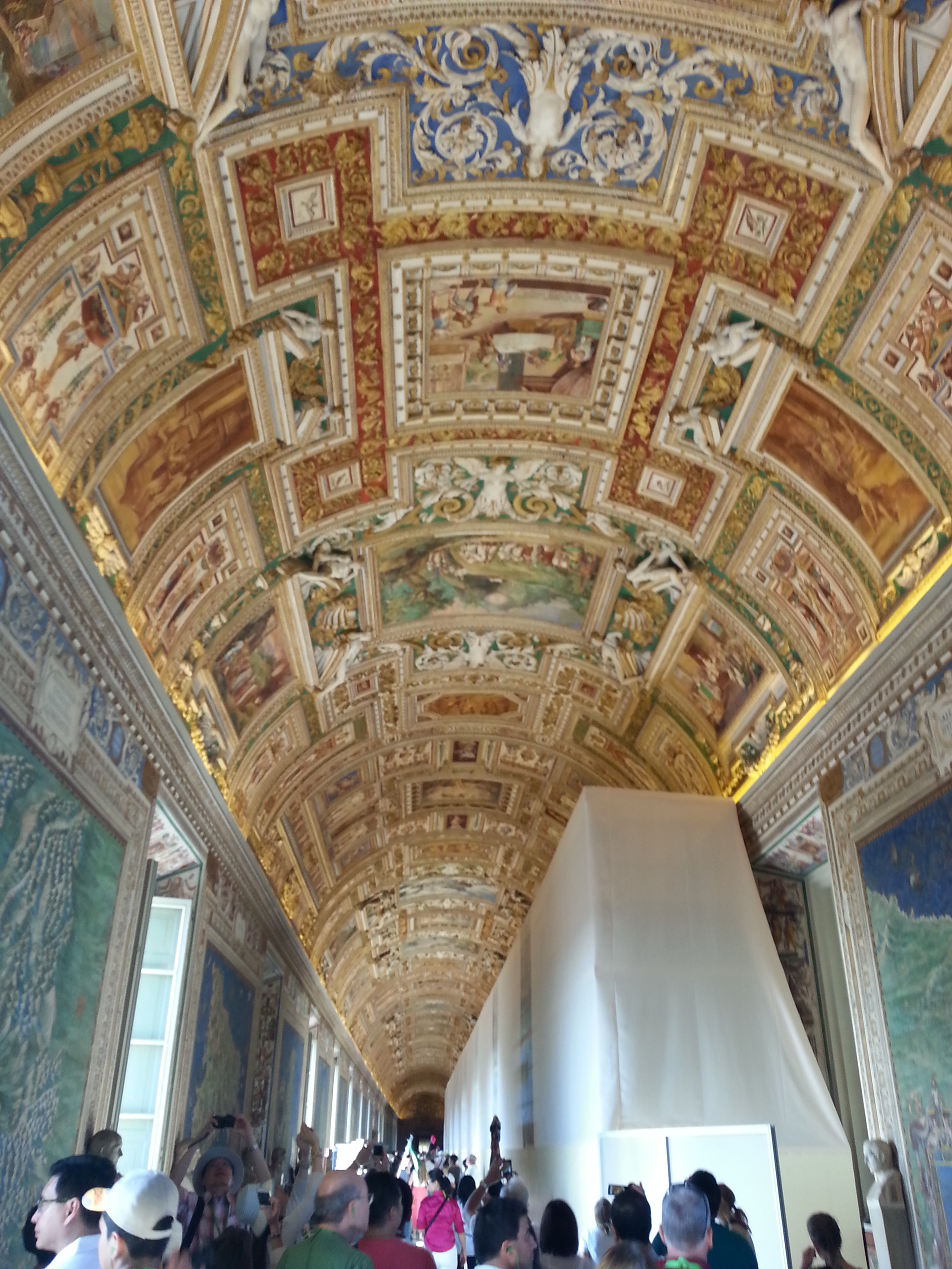 The fresco scenes that line the barrel-vaulted ceiling in the Gallery of Maps depict a variety of saints, apostles, martyrs, and other figures of Christianity. The figures within these frescoes can be linked to their location on the map, which is found on the wall just below the paintings. 