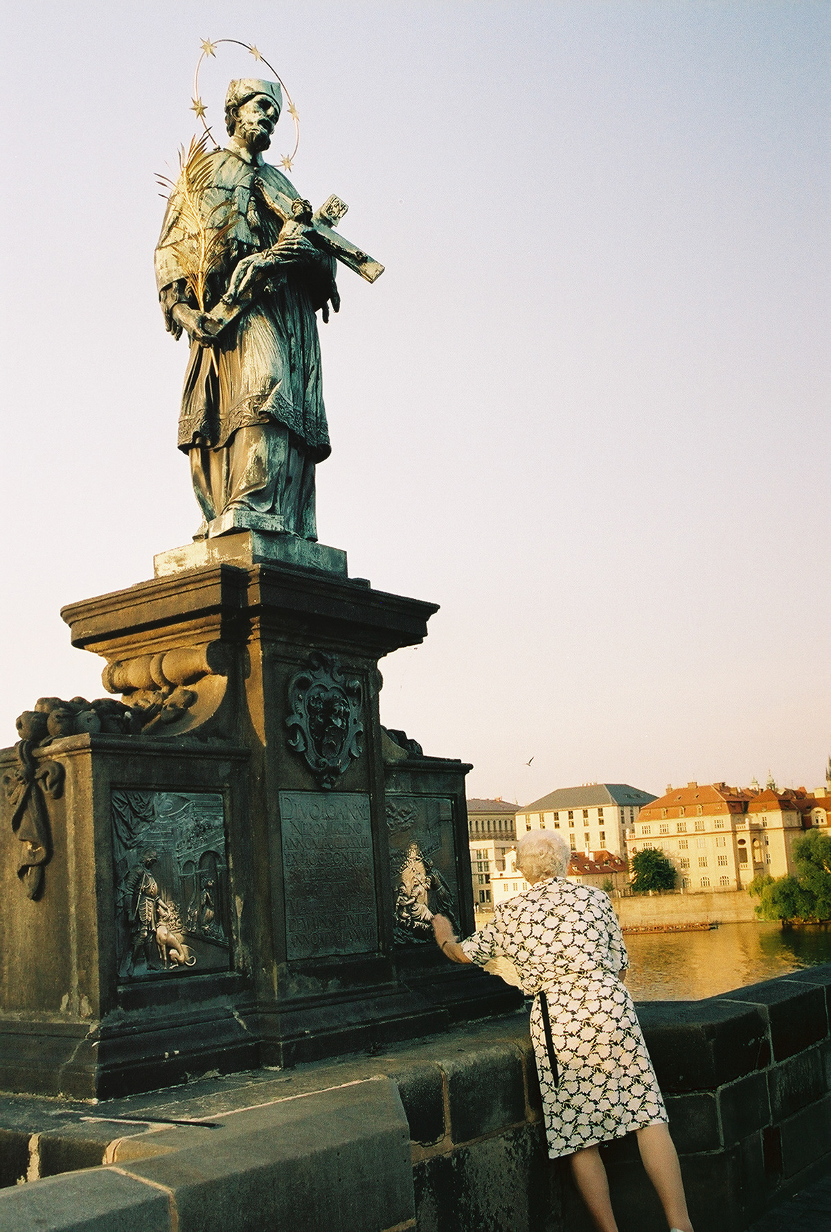 Charles Bridge statues - John of Nepomuk. Installed in 1683 on the north side of the Charles Bridge in Prague, Czech Republic. It was the first of the many Baroque images of saints to be installed on the bridge.