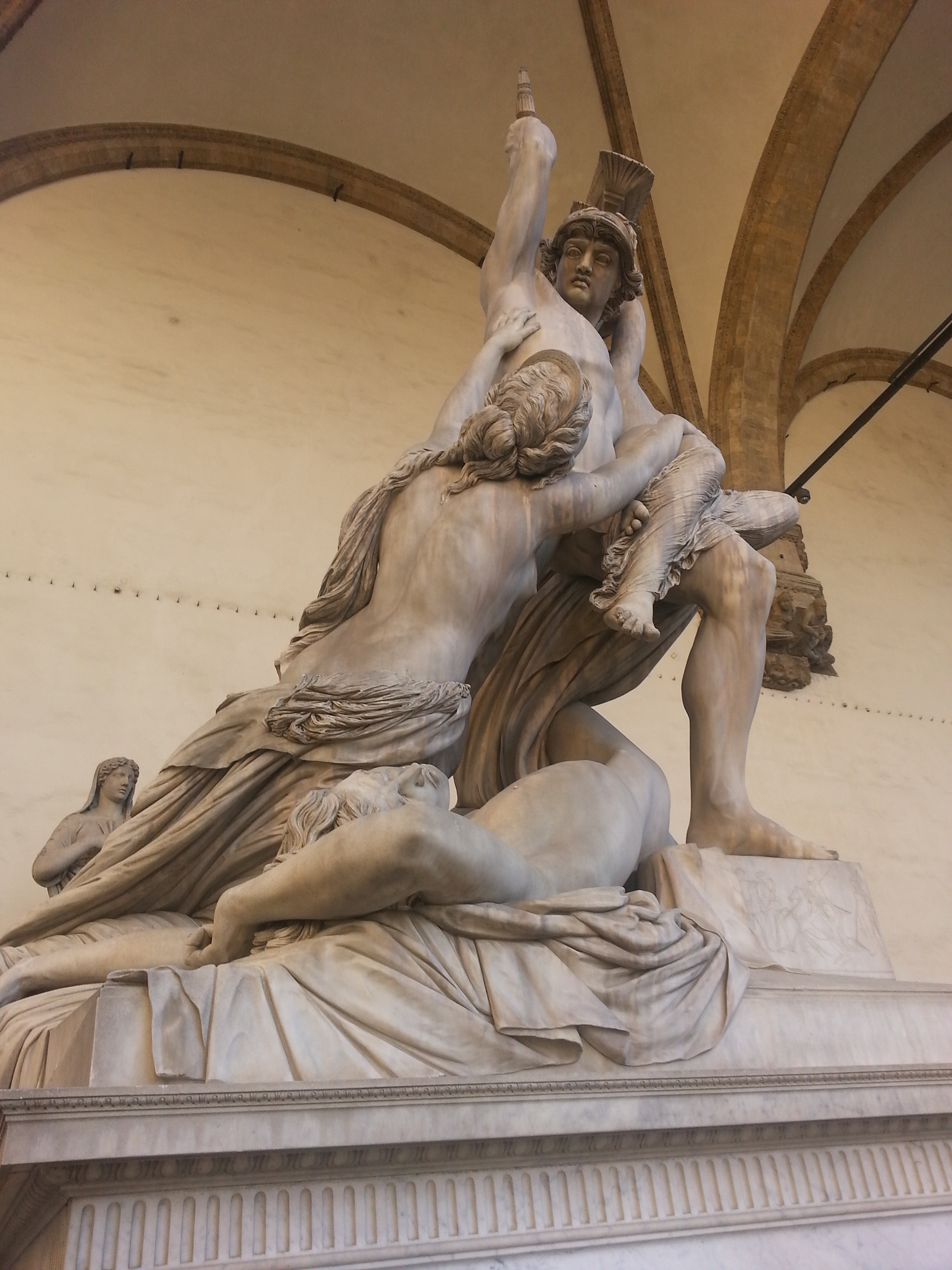 Polyxena was the daughter of King Priam and Queen Hecuba of Troy. Achilles fell in love and wished to marry her. One story relates that she helped set up his murder and another tells that he died in battle. Achilles ghost demanded Polyxena's sacrifice on his tomb. This sculpture shows the Greeks seizing her. 