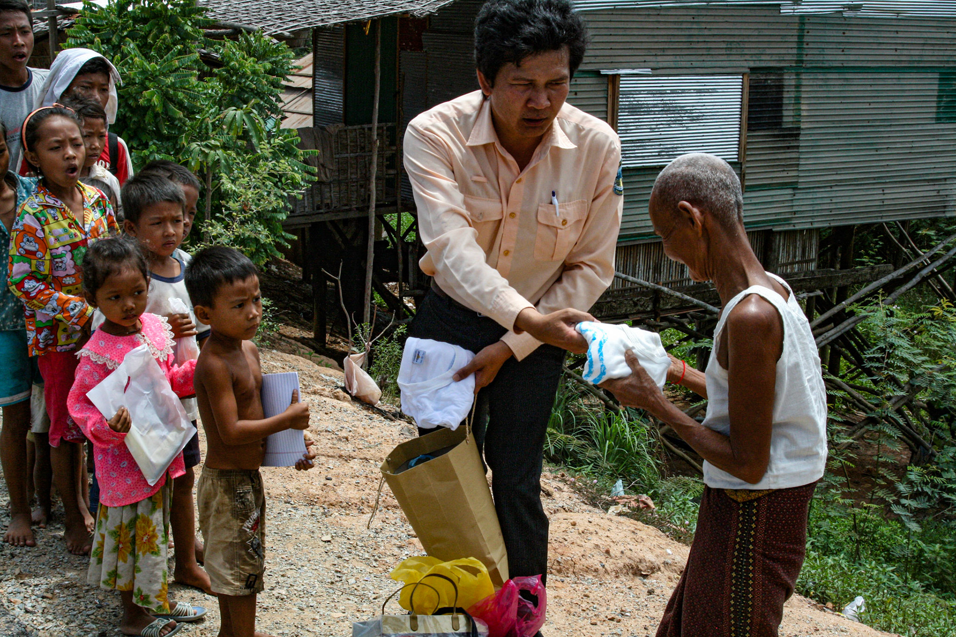 Our tour guide delivers varied and sundry gifts to some local villagers. Clothes, hygiene products, paper goods and other small items are among some of the items he collects for each time he visits. 