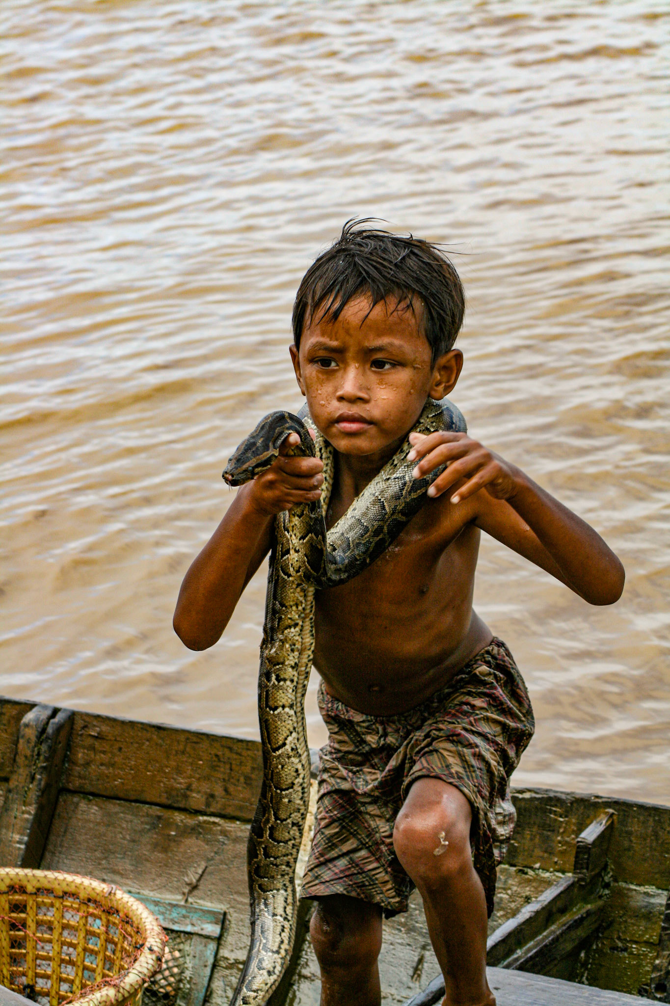 The locals have sometimes taken to bringing their young children up to the tourist boats to beg for coins. Some show off the biodiversity of the region—much to the chagrin of some tourists! 